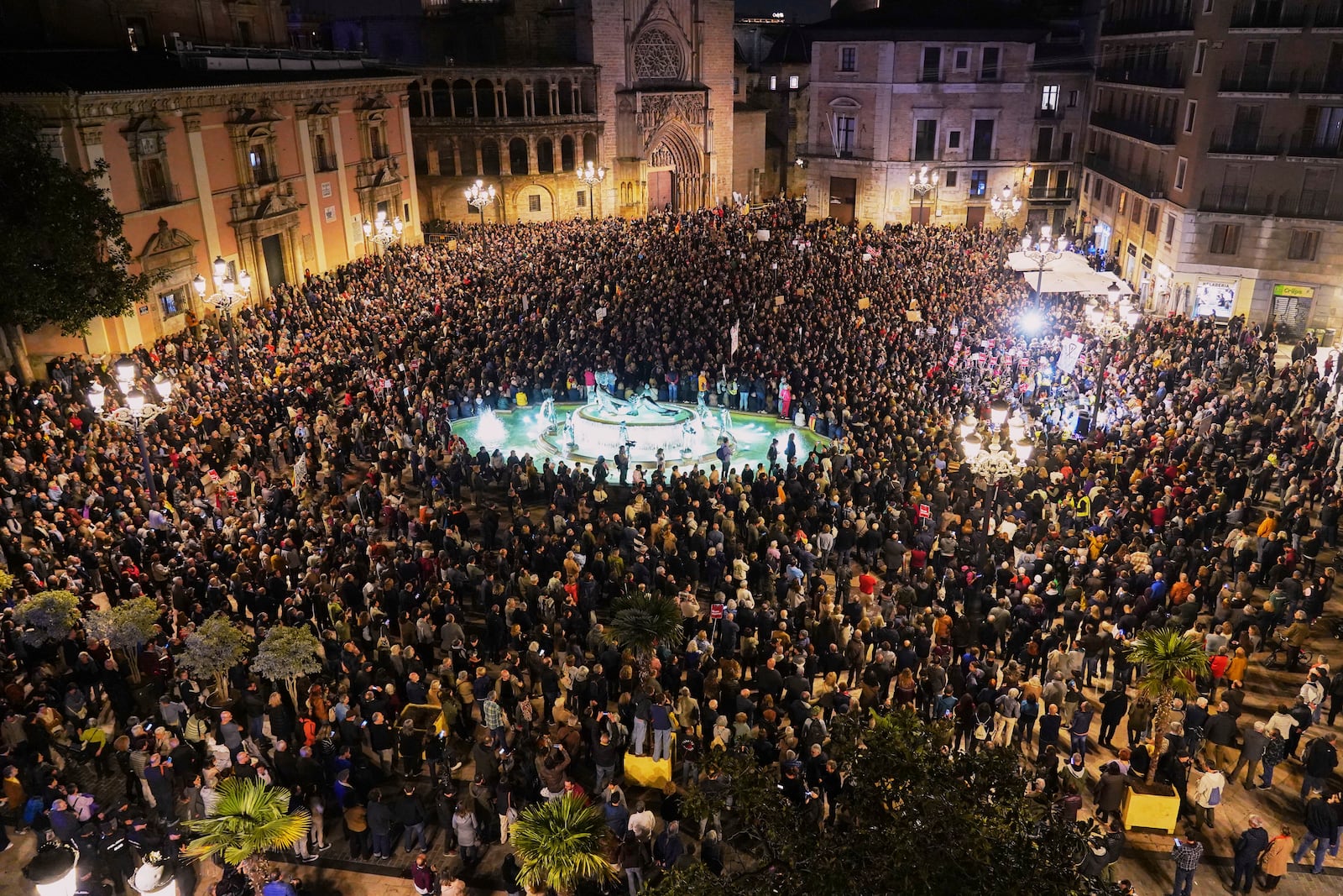 Demonstrators gather a month after devastating floods to demand the resignation of the regional officials who bungled the emergency response in Valencia, Spain, Tuesday, Nov. 30, 2024. (AP Photo/ Alberto Saiz)