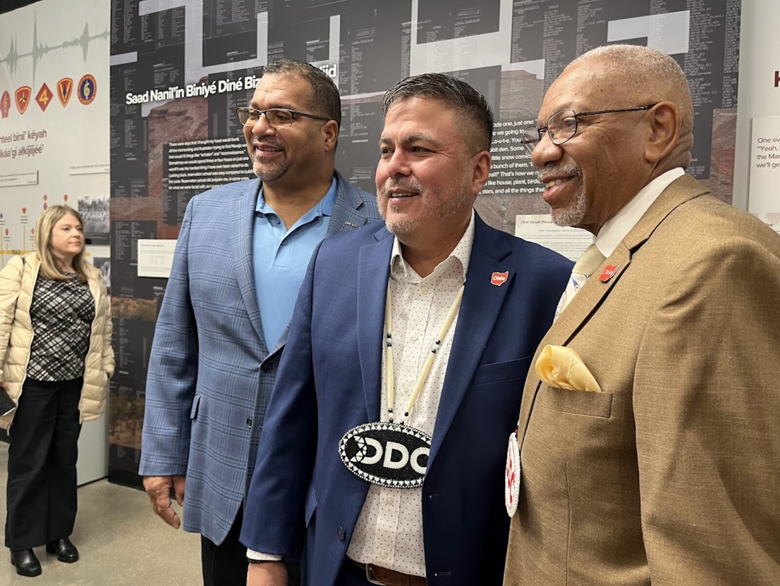 Austin Tsosie, center, chief executive of the Diné Development Corp. after his company's downtown Dayton ribbon-cutting Thursday. To Tsosie's right is Dayton City Commissioner Chris Shaw. To his left is Dayton Mayor Jeffrey Mims. THOMAS GNAU/STAFF