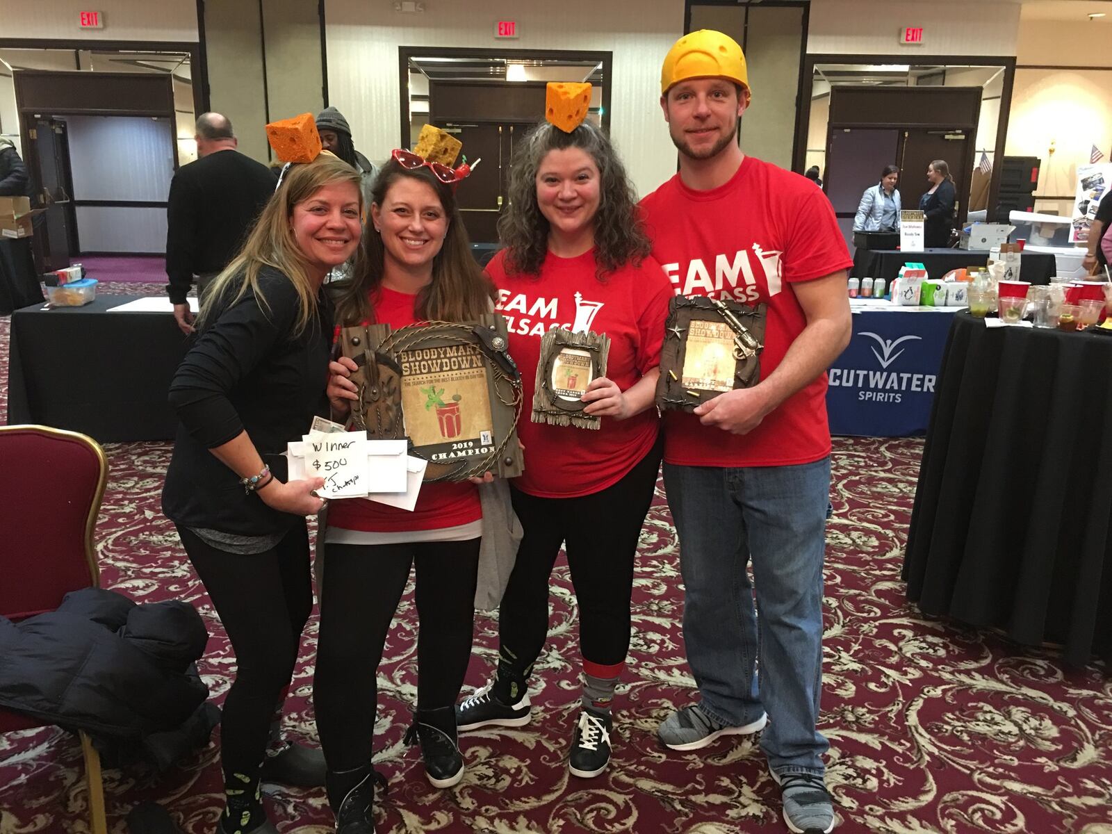 TJ Chumps bartender Jenn Elsass, a former winner of the Bloody Mary Showdown, stands next to servers Jaclyn Brock and Emily Huff and her husband Brian Elsass. CONTRIBUTED/ALEXIS LARSEN