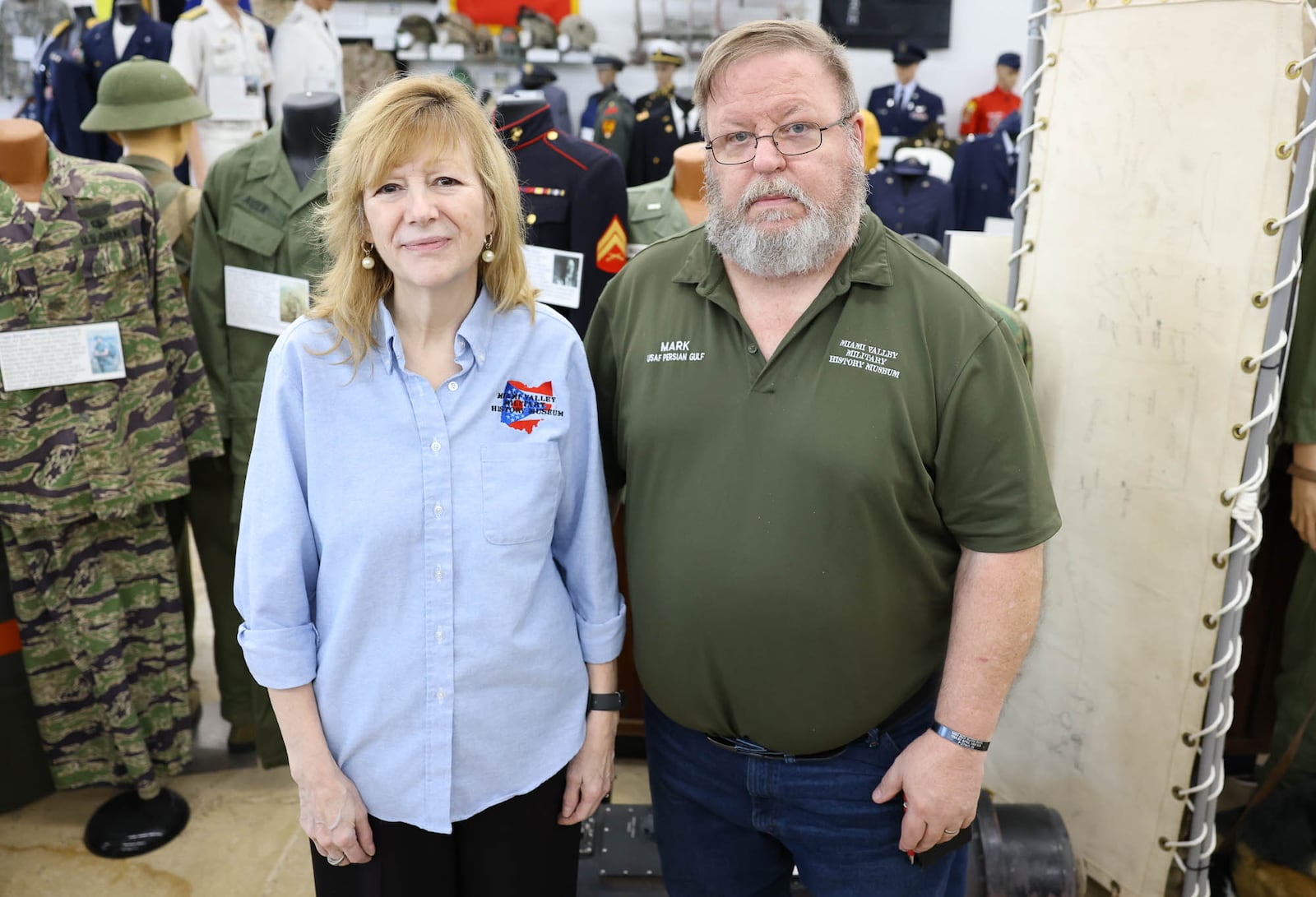 Catherine Beers-Conrad and Mark Conrad are surrounded by artifacts  in the Miami Valley Military History Museum in Fairborn. Mark Conrad is the founder of the museum, and his wife Catherine has been instrumental in the museum's operation. BRYANT BILLING / STAFF