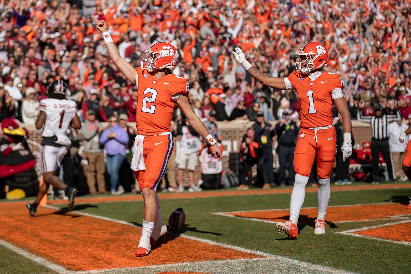 Clemson quarterback Cade Klubnik (2) celebrates his touchdown with wide receiver T.J. Moore (1) in the first half of an NCAA college football game against South Carolina, Saturday, Nov. 30, 2024, in Clemson, S.C. (AP Photo/Jacob Kupferman)