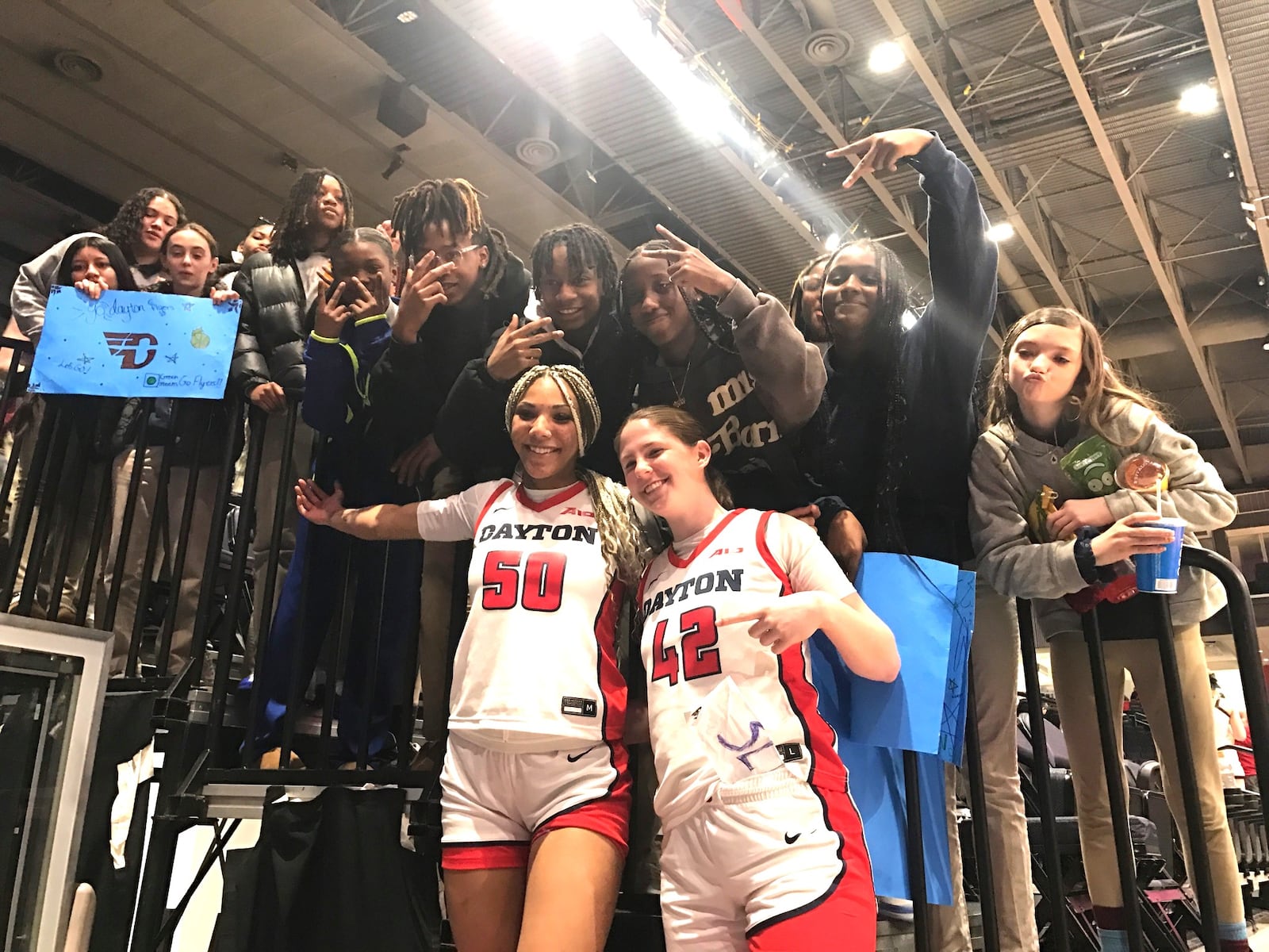 Center Eve Fiala  and forward Eleanor Monyek were two of the most popular Flyers players Wednesday at  the annual School Day game that this year set the all-time UD Arena attendance record for a Dayton women’s game with a crowd of 12,129, most of which were young students from 62 area schools. Tom Archdeacon/CONTRIBUTED