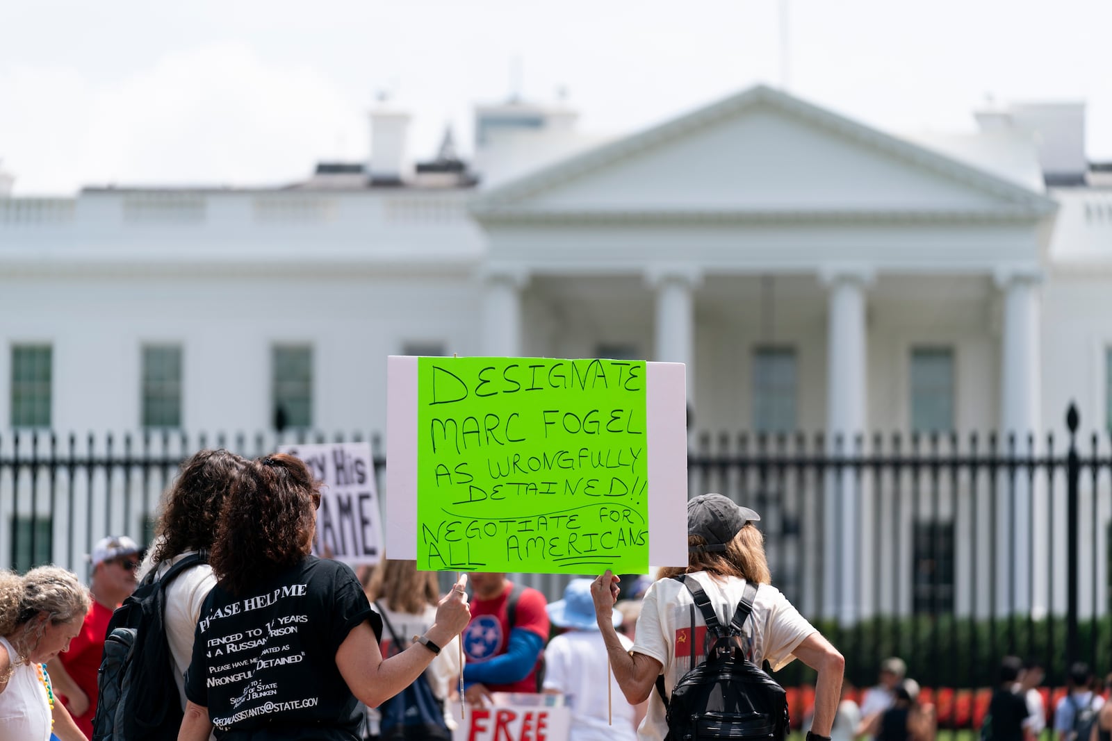 FILE - Family members, friends and colleagues of Marc Fogel, who has been detained in Russia since August 2021, rally for his release outside of the White House, July 15, 2023, in Washington. (AP Photo/Stephanie Scarbrough, File)