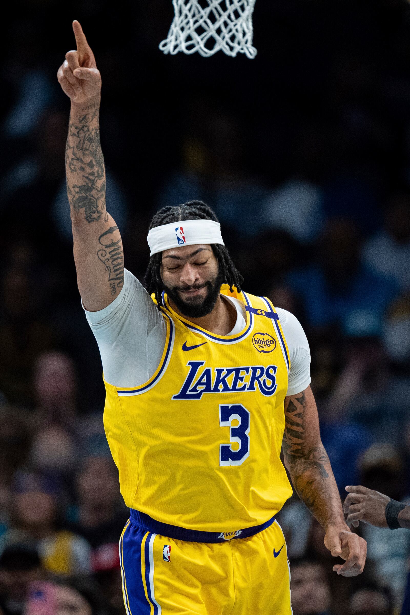 Los Angeles Lakers forward Anthony Davis reacts after dunking against the Charlotte Hornets during the first half of an NBA basketball game Monday, Jan. 27, 2025, in Charlotte, N.C. (AP Photo/Jacob Kupferman)