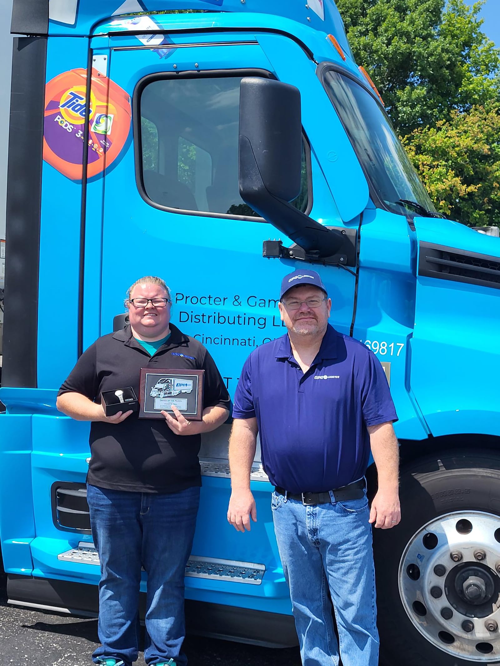 Tilton (L) receiving a 2024 Driver of the Month award from CPC Logistics in April. She is shown with her operations manager, Bill Kinman.