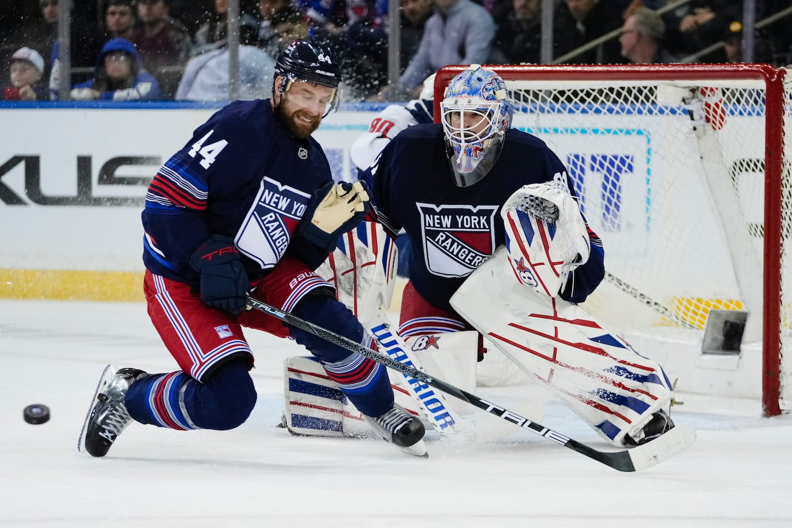 New York Rangers' Calvin de Haan (44) and goaltender Igor Shesterkin (31) stops a shot during the second period of an NHL hockey game against the Washington Capitals Wednesday, March 5, 2025, in New York. (AP Photo/Frank Franklin II)