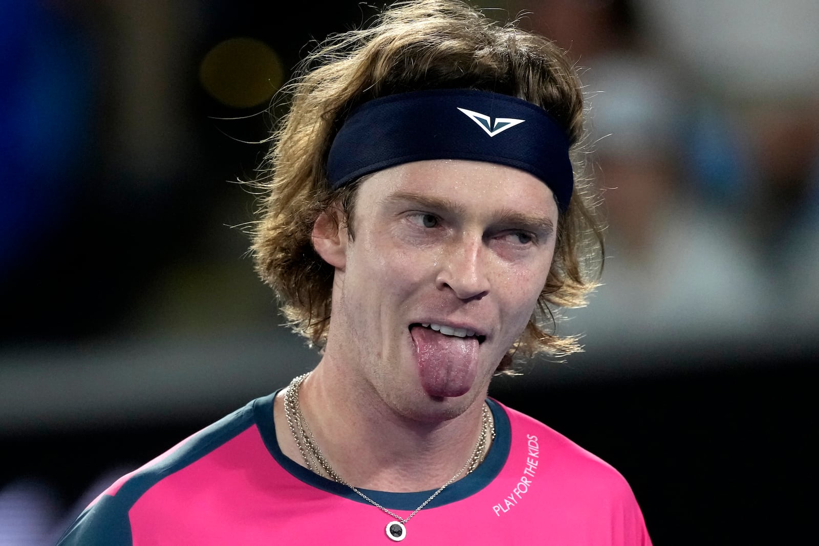 Andrey Rublev of Russia reacts during his first round match against Joao Fonseca of Brazil at the Australian Open tennis championship in Melbourne, Australia, Tuesday, Jan. 14, 2025. (AP Photo/Asanka Brendon Ratnayake)