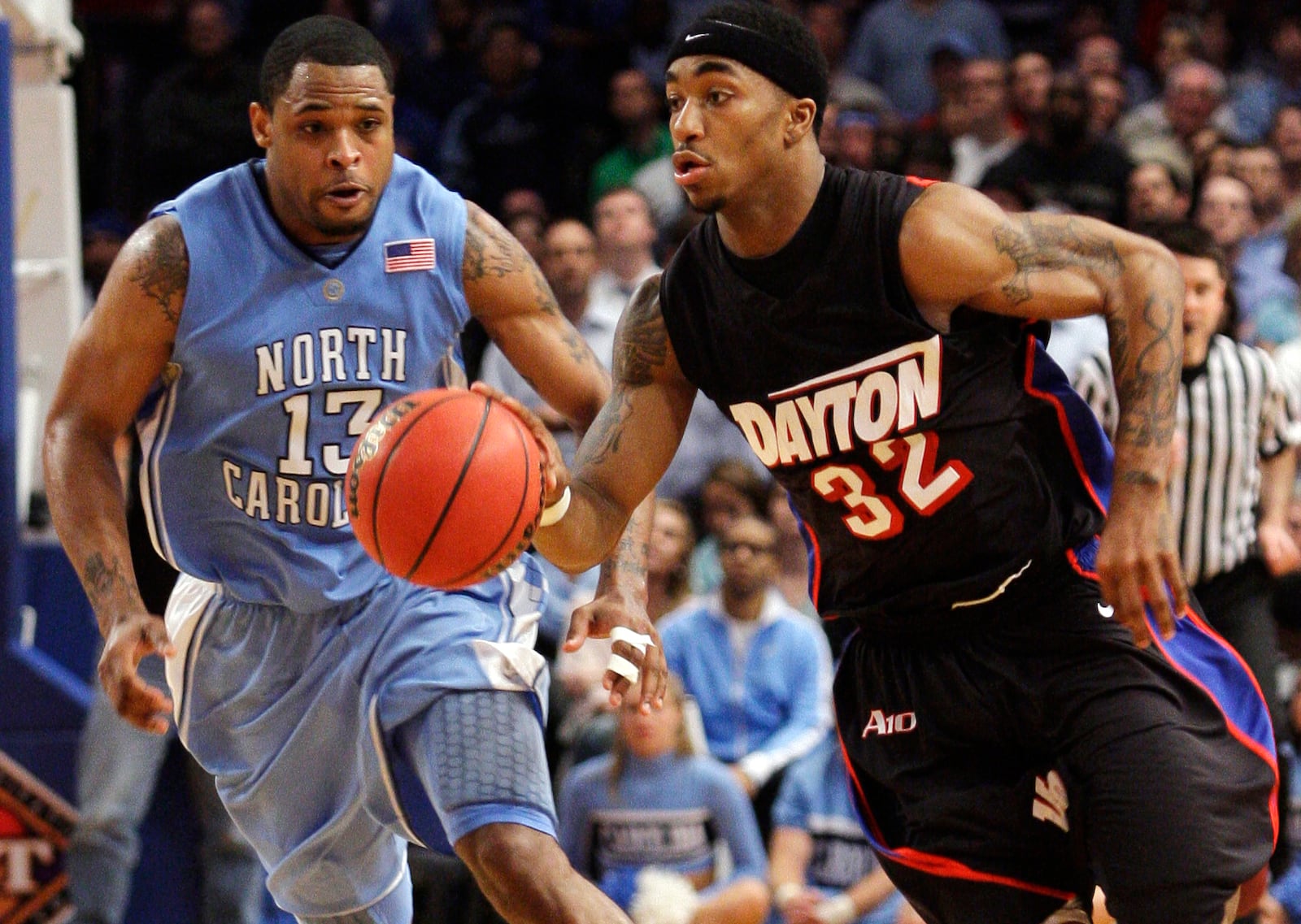 Dayton’s Marcus Johnson (32) races past North Carolina’s Will Graves (13) during the second half of the NIT title gameThursday, April 1, 2010, in New York.