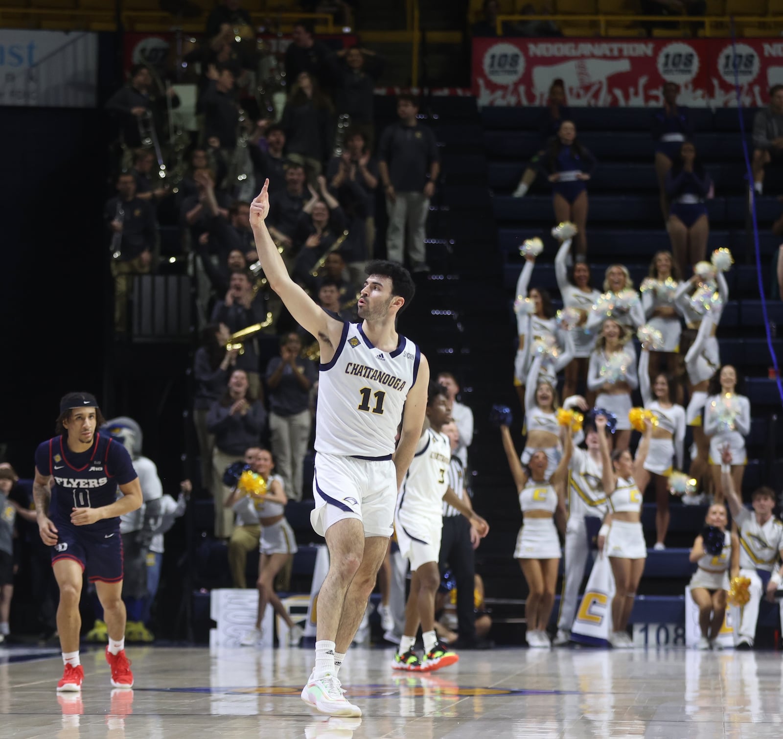 Chattanooga's Jack Kostel reacts after making a 3-pointer in the second half against Dayton in the second round of the National Invitation Tournament on Saturday, March 22, 2025, at McKenzie Arena in Chattanooga, Tenn. David Jablonski/Staff