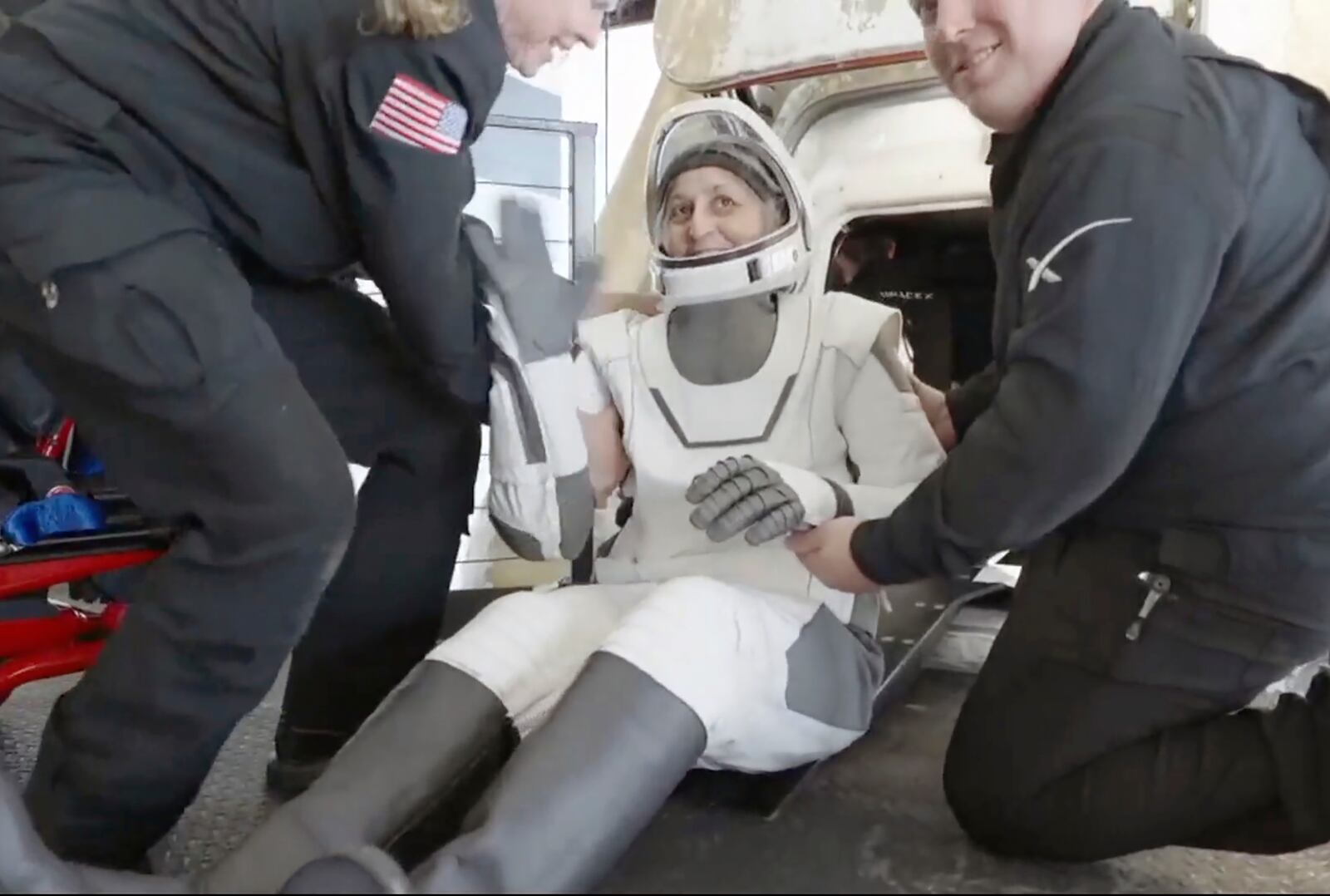 This image taken from video provided by SpaceX shows NASA's Suni Williams being helped after exiting the SpaceX capsule, Tuesday, March 18, 2025. (SpaceX via AP)