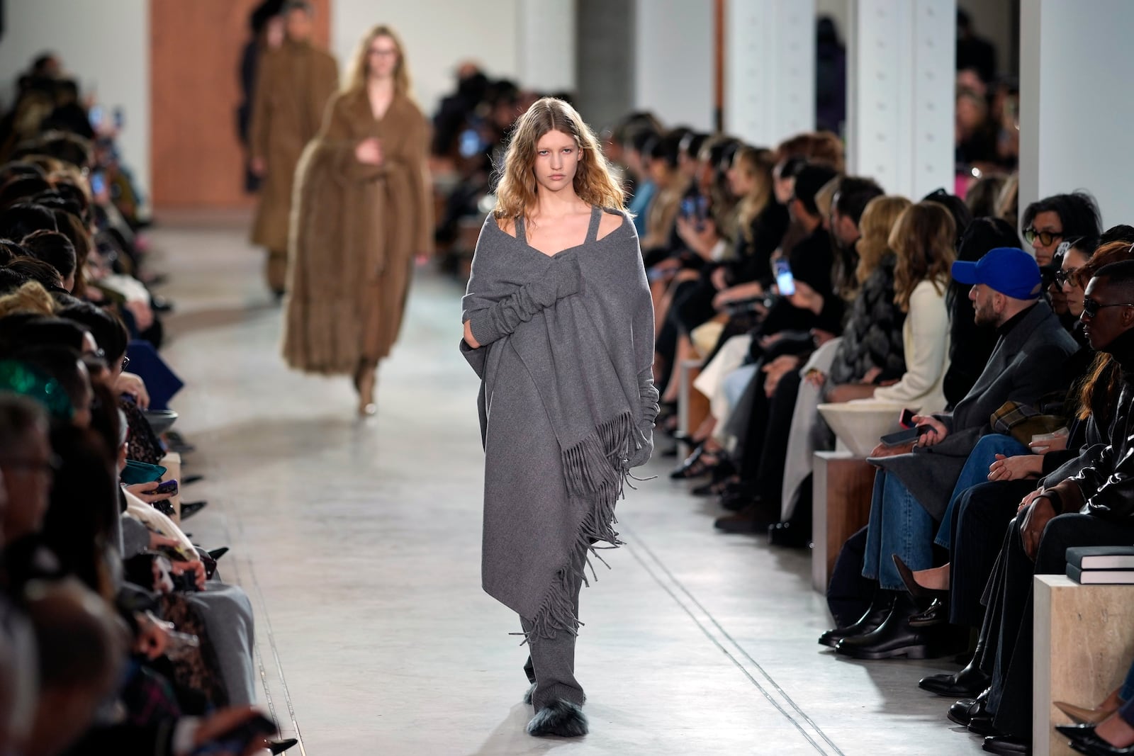 Models walk the runway during the Michael Kors Fall/Winter 2025 fashion show as part of New York Fashion Week on Tuesday, Feb. 11, 2025, at Terminal Warehouse in New York. (Photo by Charles Sykes/Invision/AP)