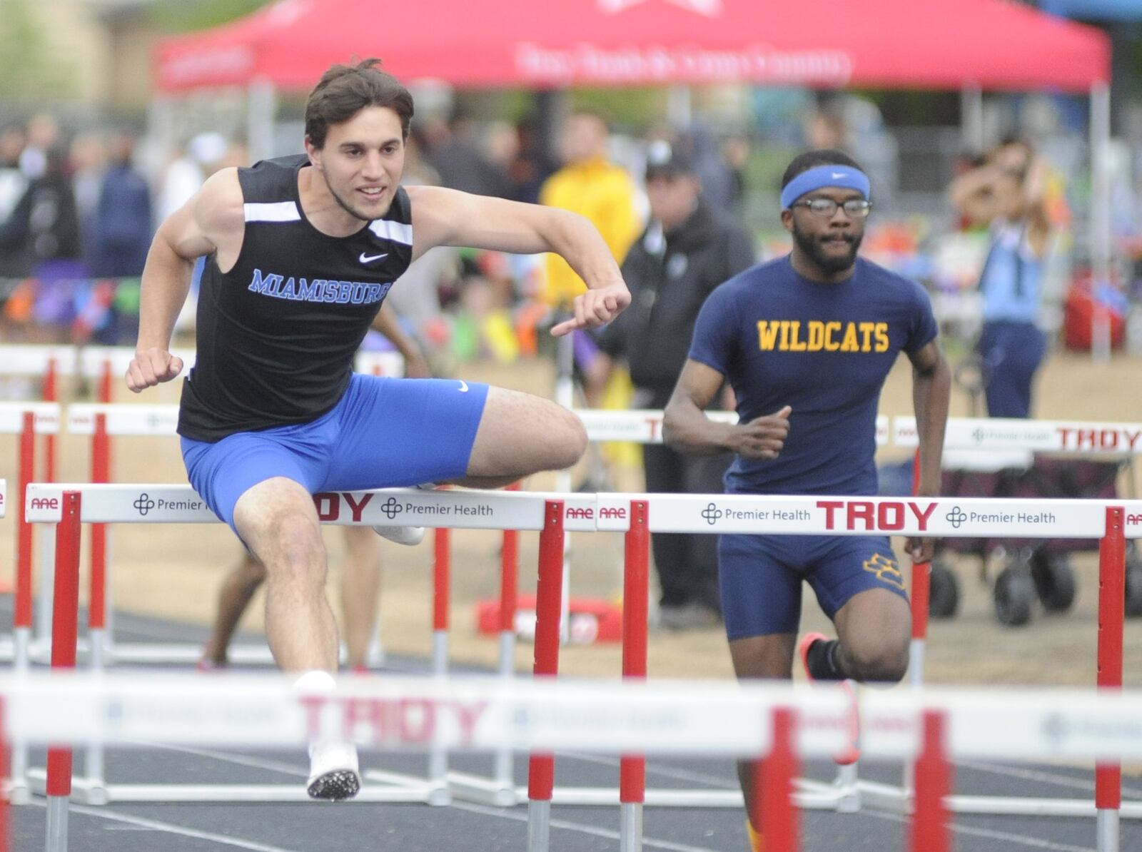 Miamisburg senior Colin Dillon (left) won the 110-meter high hurdles (14.24) and Springfield senior Austin Tyree was third during the GWOC track and field meet at Troy’s Memorial Stadium on Friday, May 10, 2019. MARC PENDLETON / STAFF