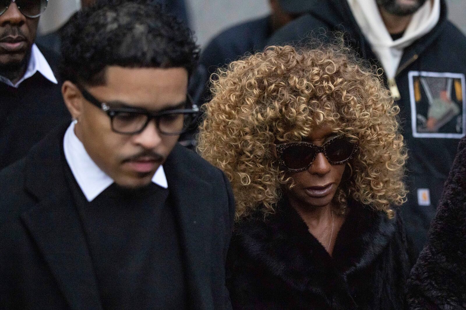 Justin Dior Combs, left, son, and Janice Combs, right, mother of Sean "Diddy" Combs, leave Manhattan federal court, Friday, Nov. 22 2024, in New York. (AP Photo/Yuki Iwamura)