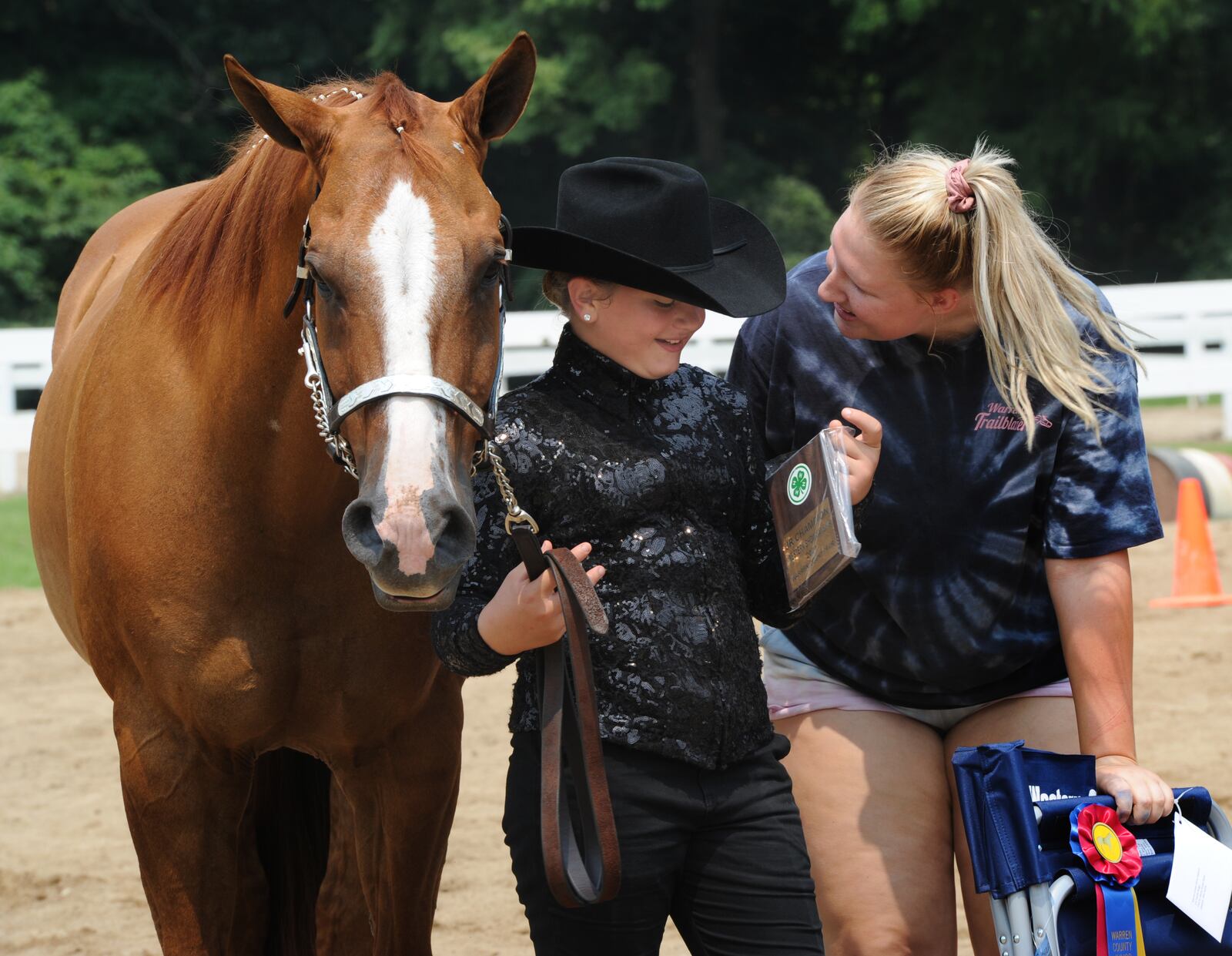 Natalie Baker, left, and Chelsea Rauh, celebrate winning the Western Showmanship Jr. Class, Tuesday July 20, 2021, at the Warrren County Fair. MARSHALL GORBY\STAFF