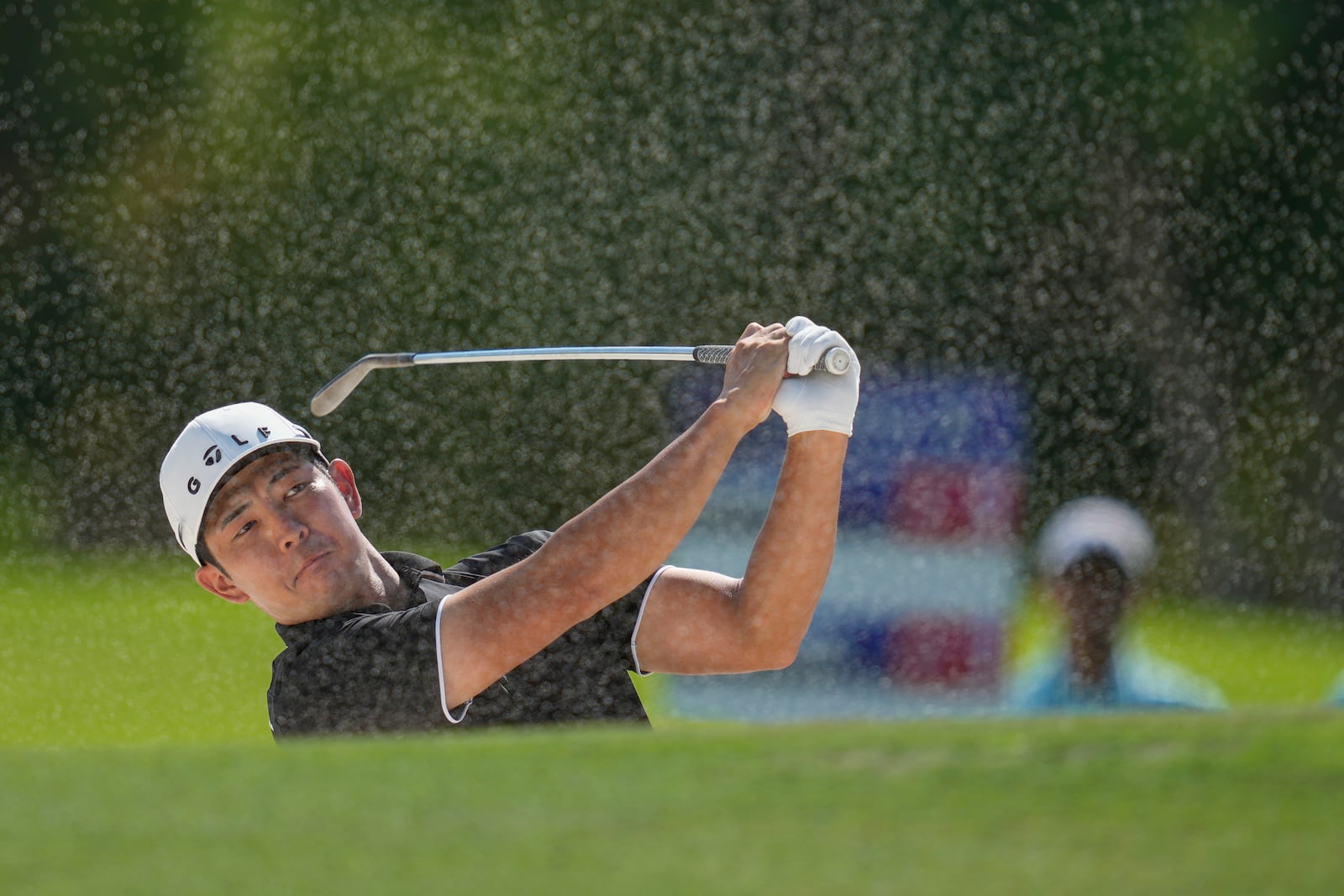 Keita Nakajima of Japan hits a shot from a bunker on the 4th hole during the second round of World Tour Golf Championship in Dubai, United Arab Emirates, Friday, Nov. 15, 2024. (AP Photo/Altaf Qadri)