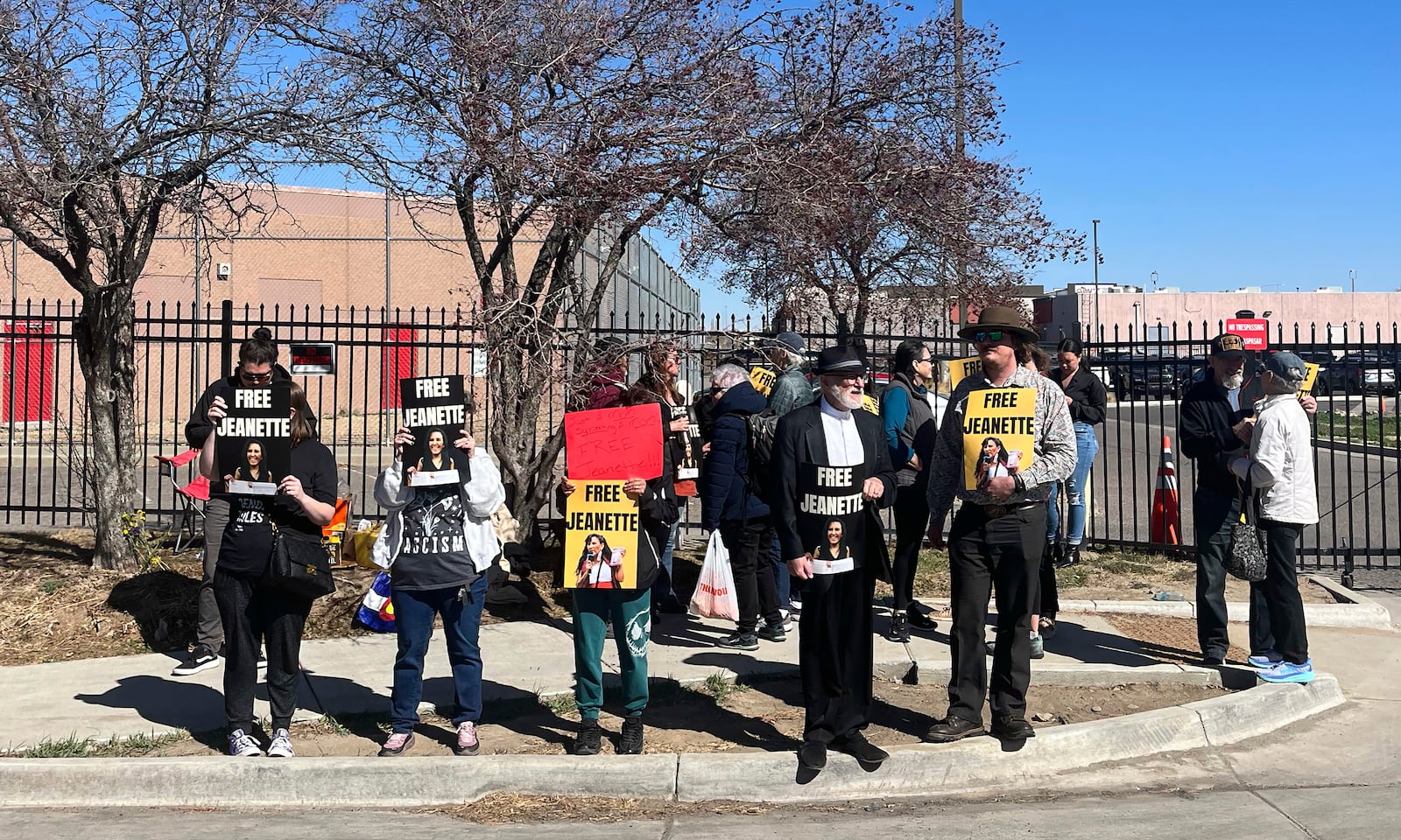 Supporters of Colorado immigration activist Jeanette Vizguerra hold signs outside the U.S. Immigration and Customs Enforcement GEO Group detention facility in Aurora, Colo., Tuesday, March 18, 2025. (RJ Sangosti/The Denver Post via AP)