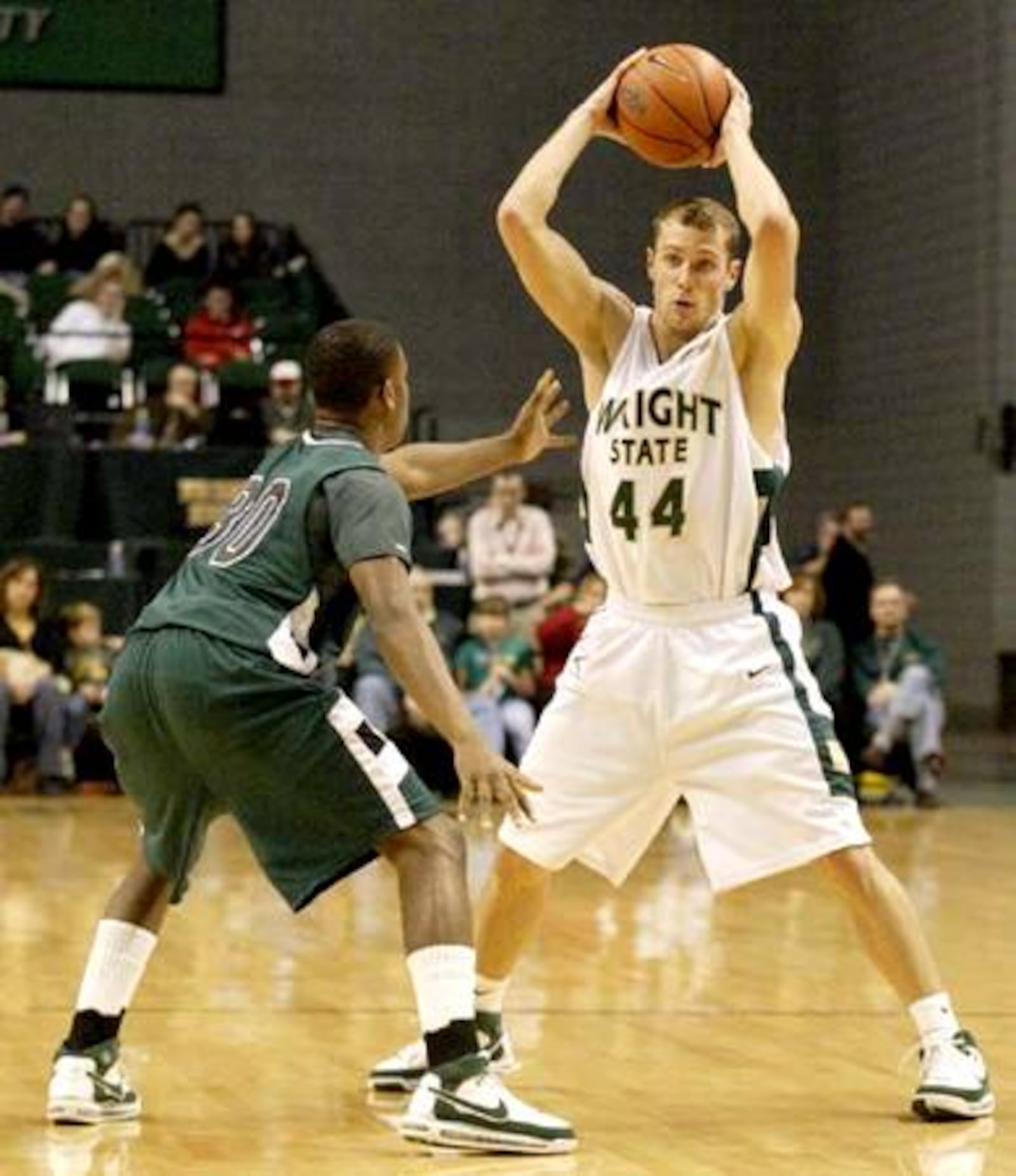 Wright State sophomore Vaughn Duggins (44) looks to pass while Cleveland State freshman Norris Cole (30) guards him as the Cleveland State Vikings play the Wright State Raiders at the Nutter Center, Saturday, January 12, 2008. Cole is a graduate of Dayton's Dunbar High School..