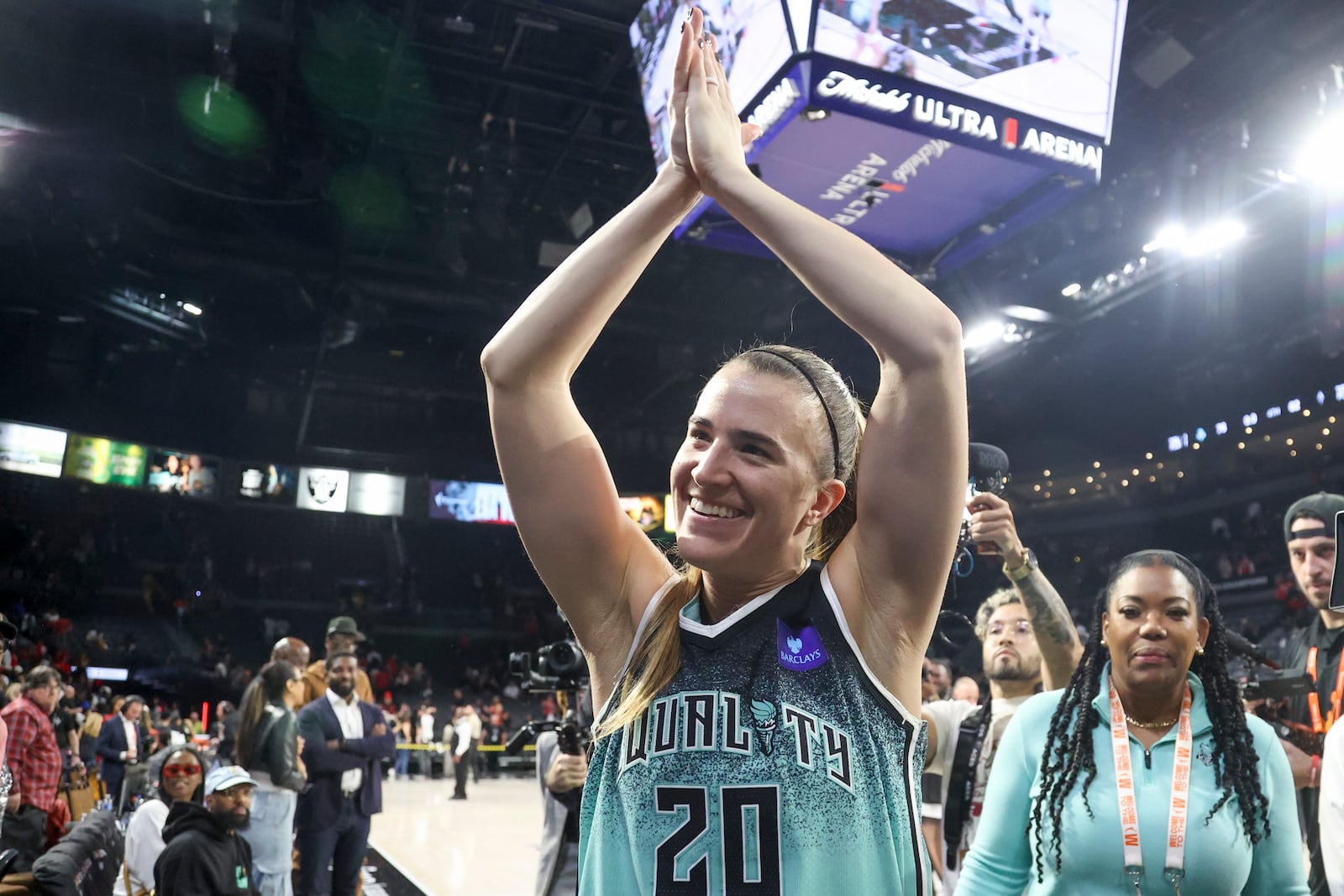 New York Liberty guard Sabrina Ionescu (20) celebrates after her team's series clinching victory against the Las Vegas Aces during a WNBA Semifinal basketball game Sunday, Oct. 6, 2024, in Las Vegas. New York won 76-62. (AP Photo/Ian Maule)