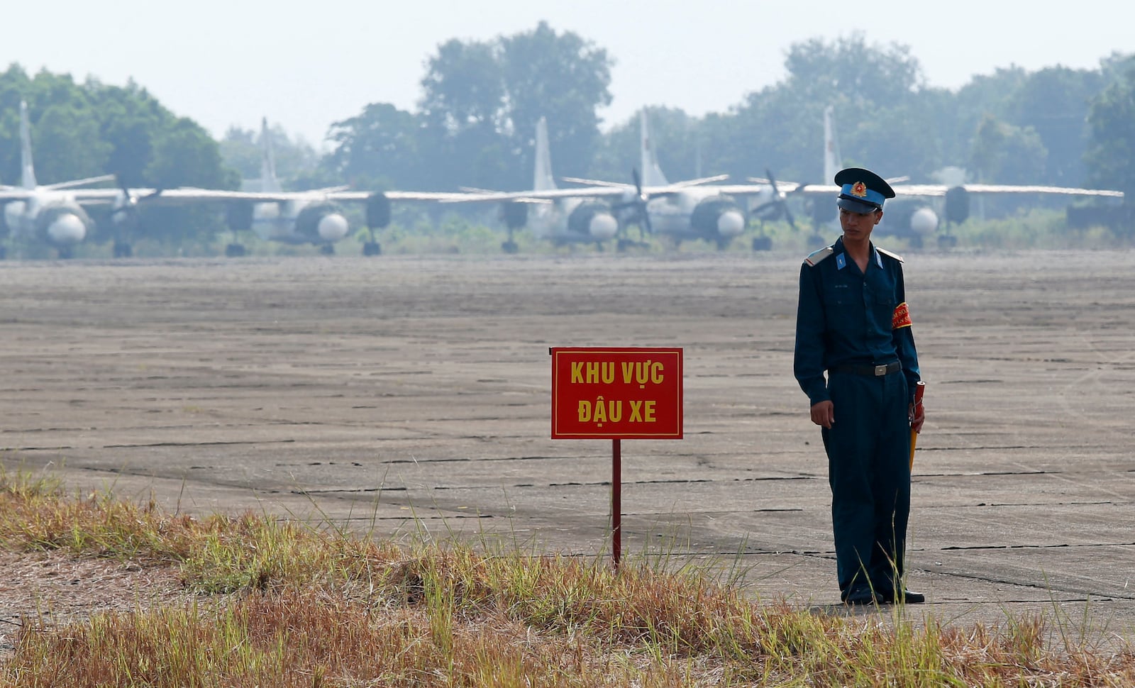 FILE- A Vietnamese soldier stands guard in front of military aircraft near a dioxin contaminated area while U.S. Defense Secretary Jim Mattis visits Bien Hoa air base in Bien Hoa, outside Ho Chi Minh City, Vietnam, Oct. 17, 2018. (Kham/Pool Photo via AP, File)