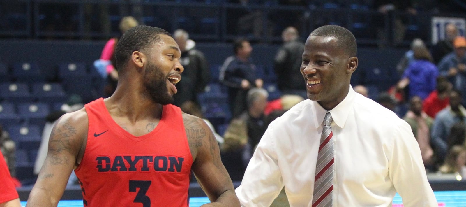 Dayton’s Trey Landers and Anthony Grant leave the court after a victory against Rhode Island on Saturday, Feb. 9, 2019, at the Ryan Center in Kingston, R.I. David Jablonski/Staff