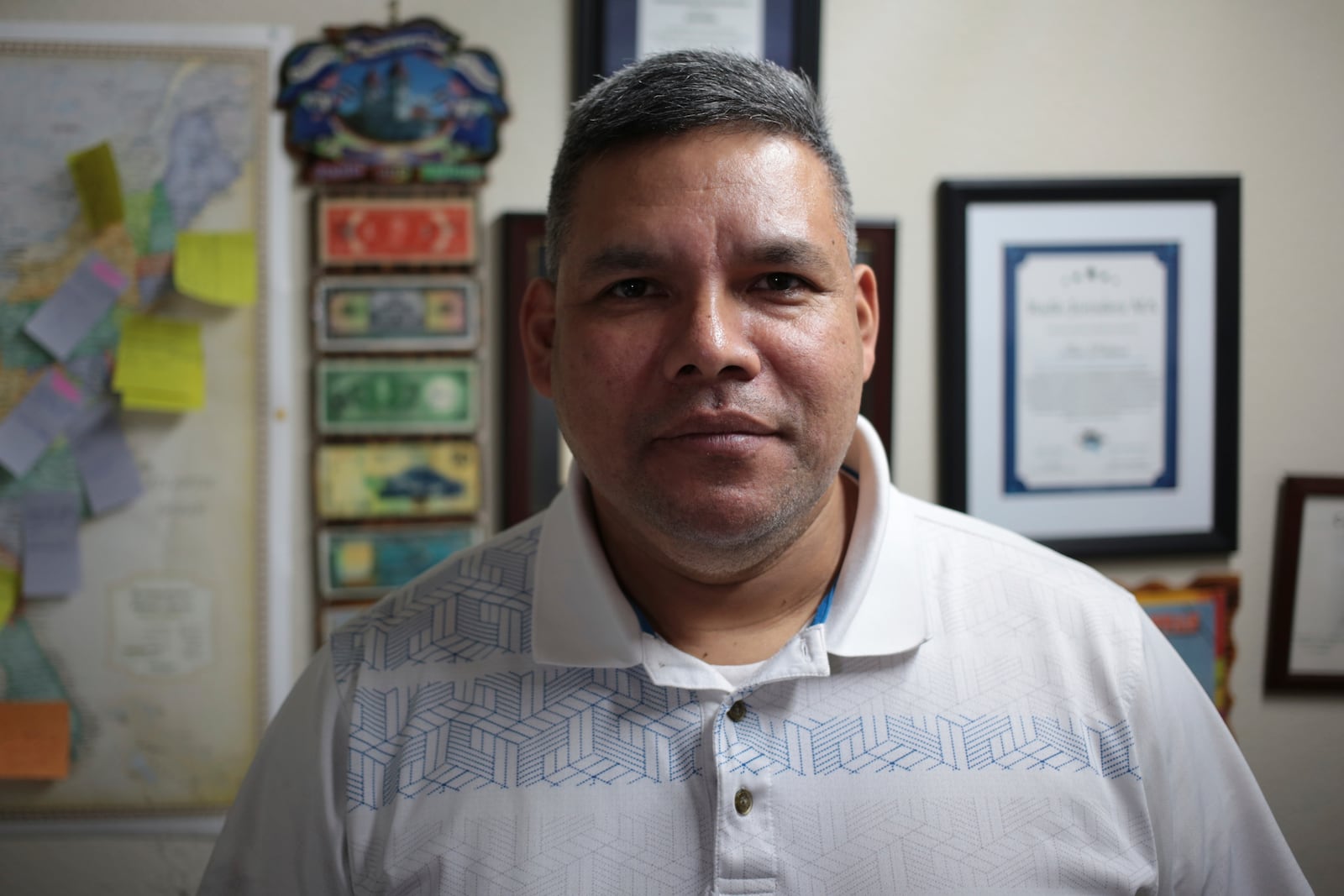 José Palma, a 48 year-old Salvadoran who has lived in the U.S. since 1998, stands in his home in Texas on Wednesday, Jan. 8, 2025. (AP Photo/Lekan Oyekanmi)