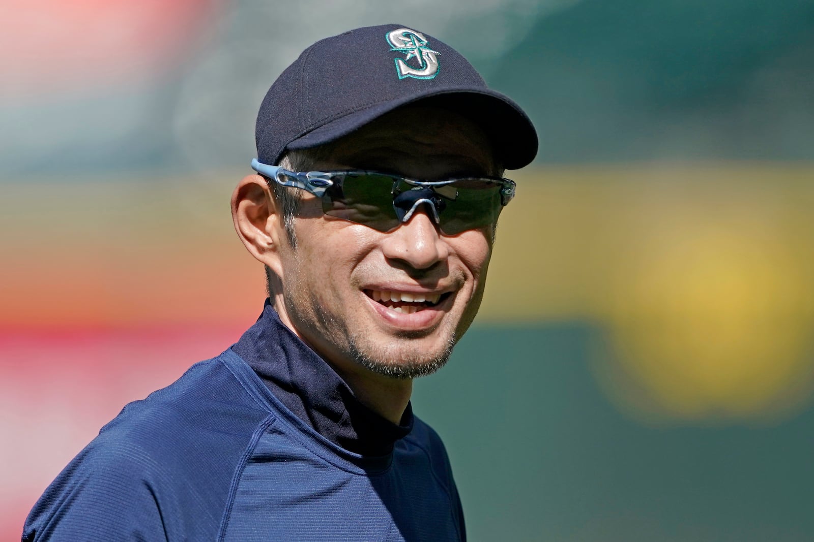 FILE - Former Seattle Mariners outfielder Ichiro Suzuki smiles as he visits with players and coaches before batting practice before the team's baseball game against the Los Angeles Angels, Thursday, June 16, 2022, in Seattle. (AP Photo/Ted S. Warren, File)