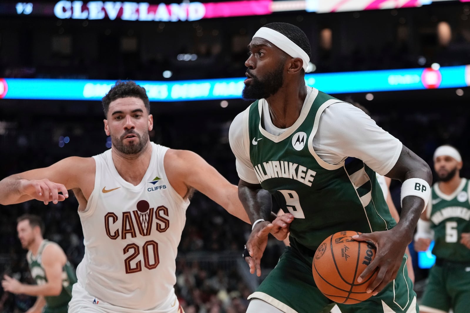 Milwaukee Bucks' Bobby Portis tries to get past Cleveland Cavaliers' Georges Niang during the first half of an NBA basketball game Saturday, Nov. 2, 2024, in Milwaukee. (AP Photo/Morry Gash)