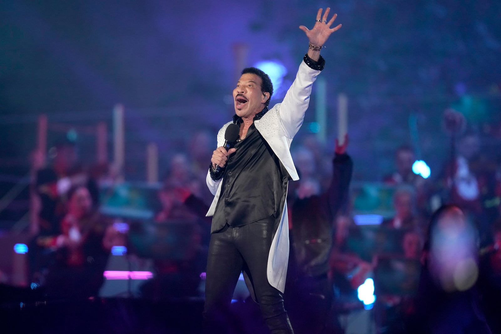 Lionel Richie performs during a concert at Windsor Castle in Windsor, England, Sunday, May 7, 2023, celebrating the coronation of King Charles III. It's one of several events over a three-day weekend of celebrations. (AP Photo/Kin Cheung, Pool)