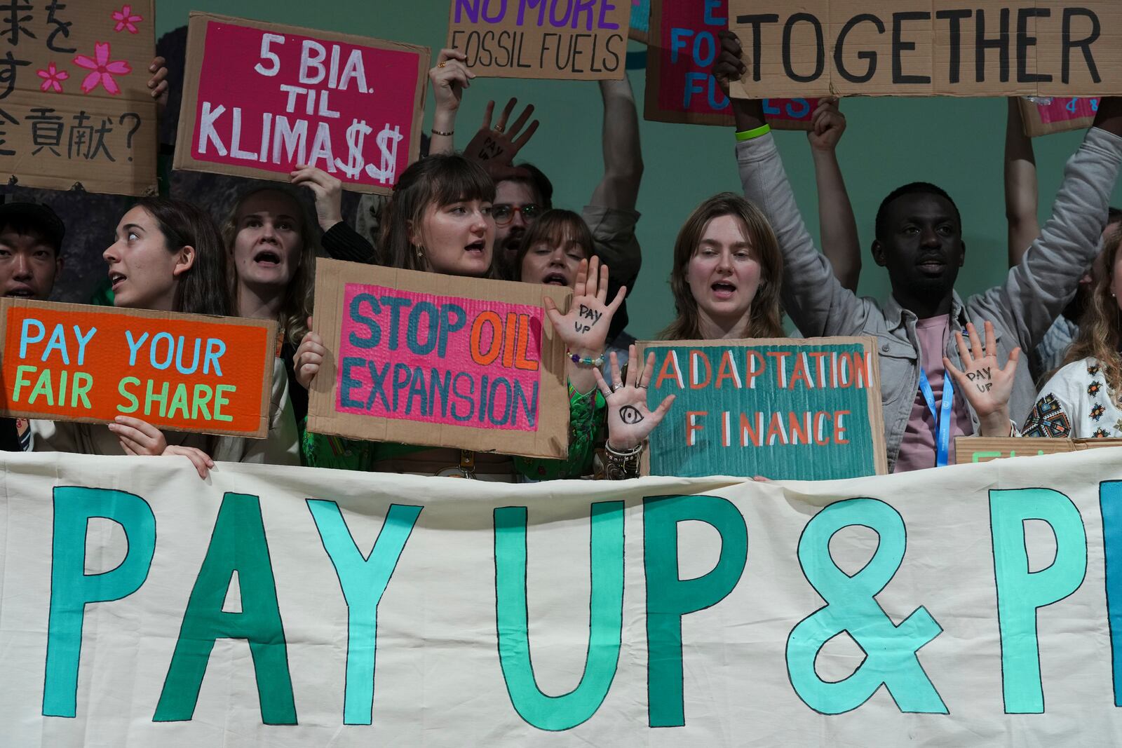 Activists participate in a demonstration for climate finance at the COP29 U.N. Climate Summit, Friday, Nov. 22, 2024, in Baku, Azerbaijan. (AP Photo/Peter Dejong)