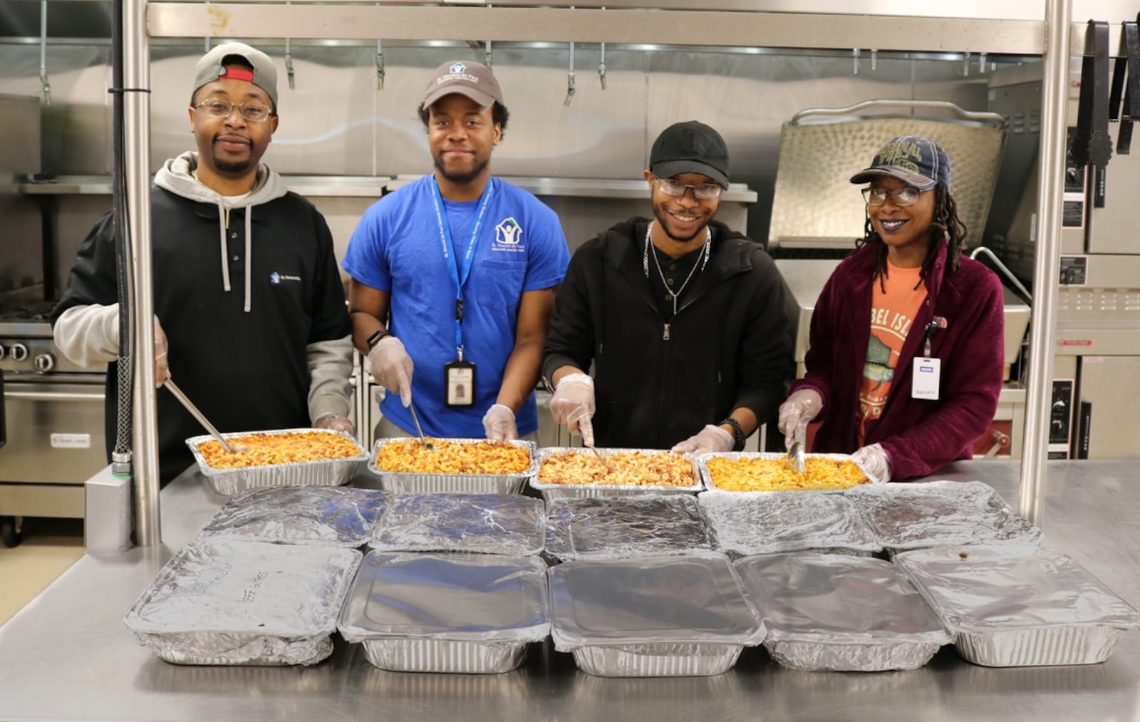 St. Vincent de Paul Society staff with casseroles.