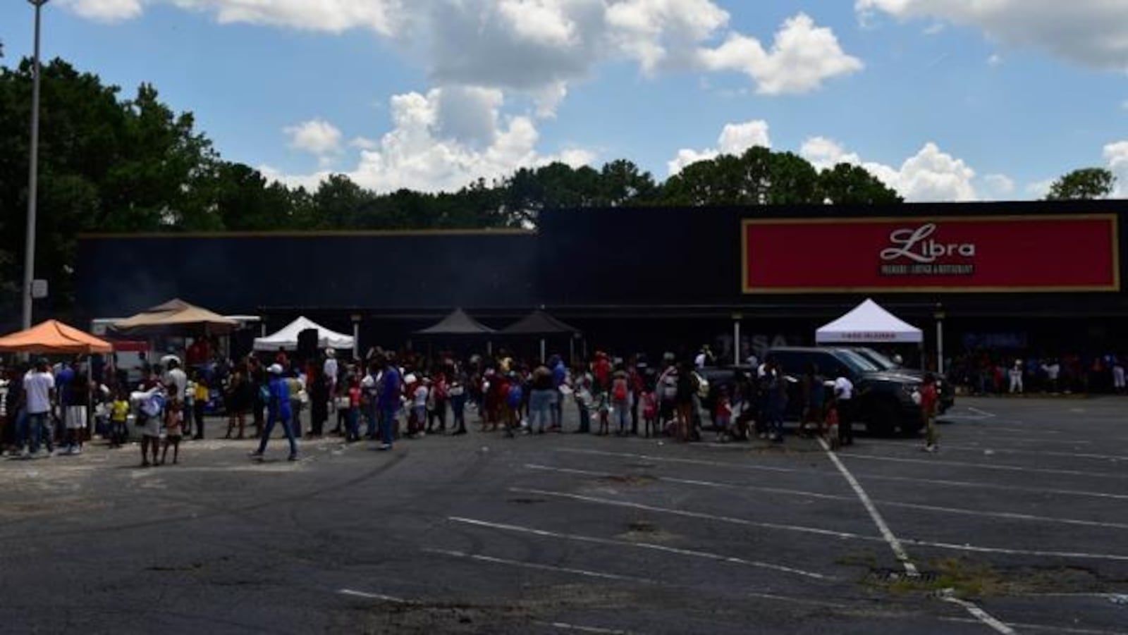 Students and their families lined up at the third annual "Issa Back 2 School Drive" in DeKalb County on Aug. 5, 2018.