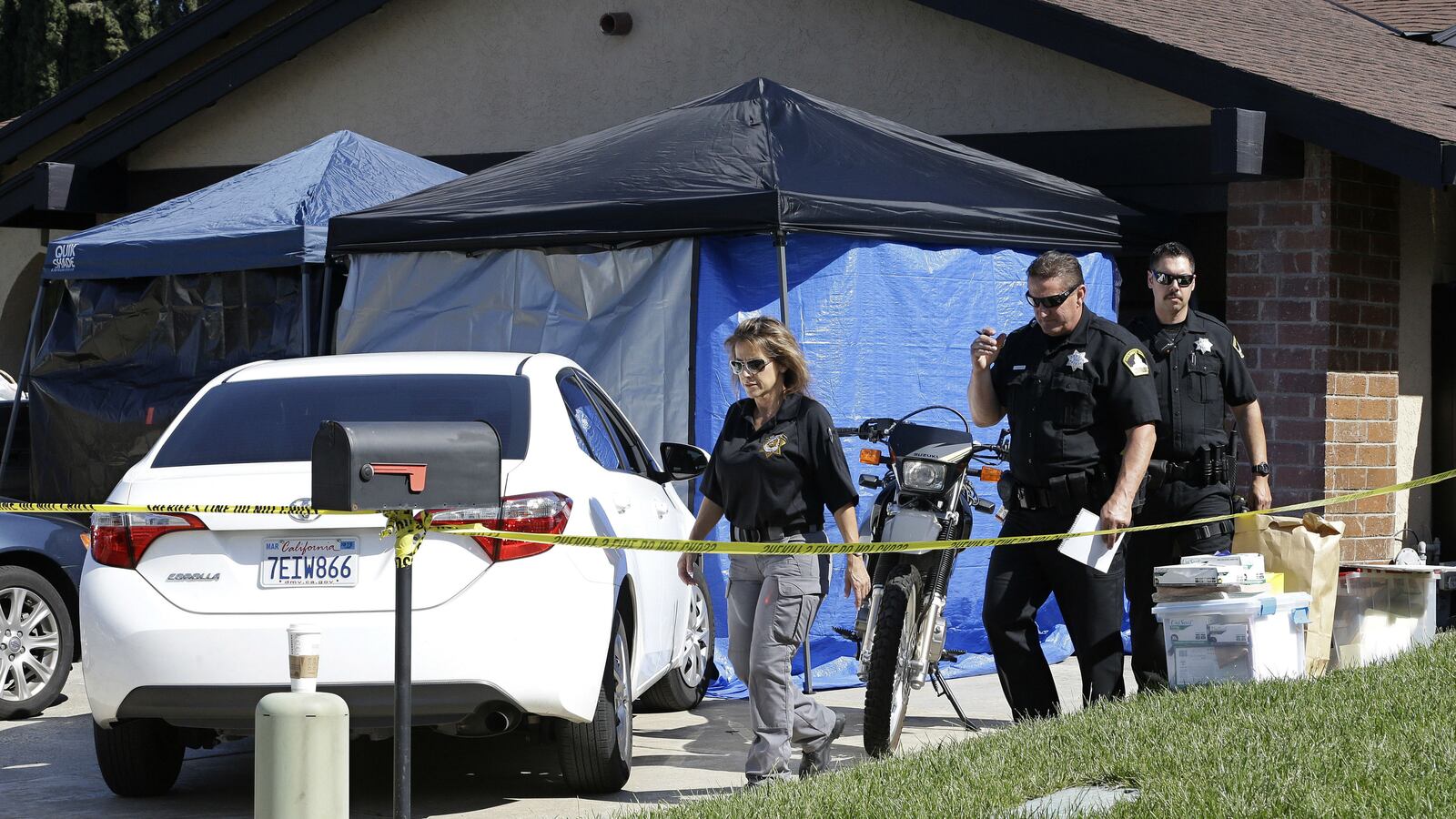 Sacramento County sheriff's deputies are pictured Wednesday, April 25, 2018, outside the home of Joseph James DeAngelo Jr. in Citrus Heights, California. DeAngelo, a 72-year-old former police officer, was arrested Tuesday, April 24, 2018, and accused of being the Golden State Killer, a serial killer and rapist responsible for at least 12 murders and 45 rapes throughout California in the 1970s and 1980s. Over four decades, the elusive killer was also known as the East Area Rapist and the Original Night Stalker.