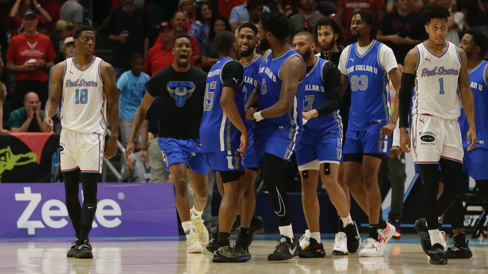 Blue Collar U celebrates a victory against Red Scare in the semifinals of The Basketball Tournament on Saturday, July 30, 2022, at UD Arena. David Jablonski/Staff