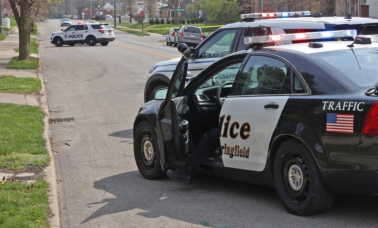 Springfield police blocked East High Street Monday after a pedestrian was struck and killed by a car. BILL LACKEY/STAFF