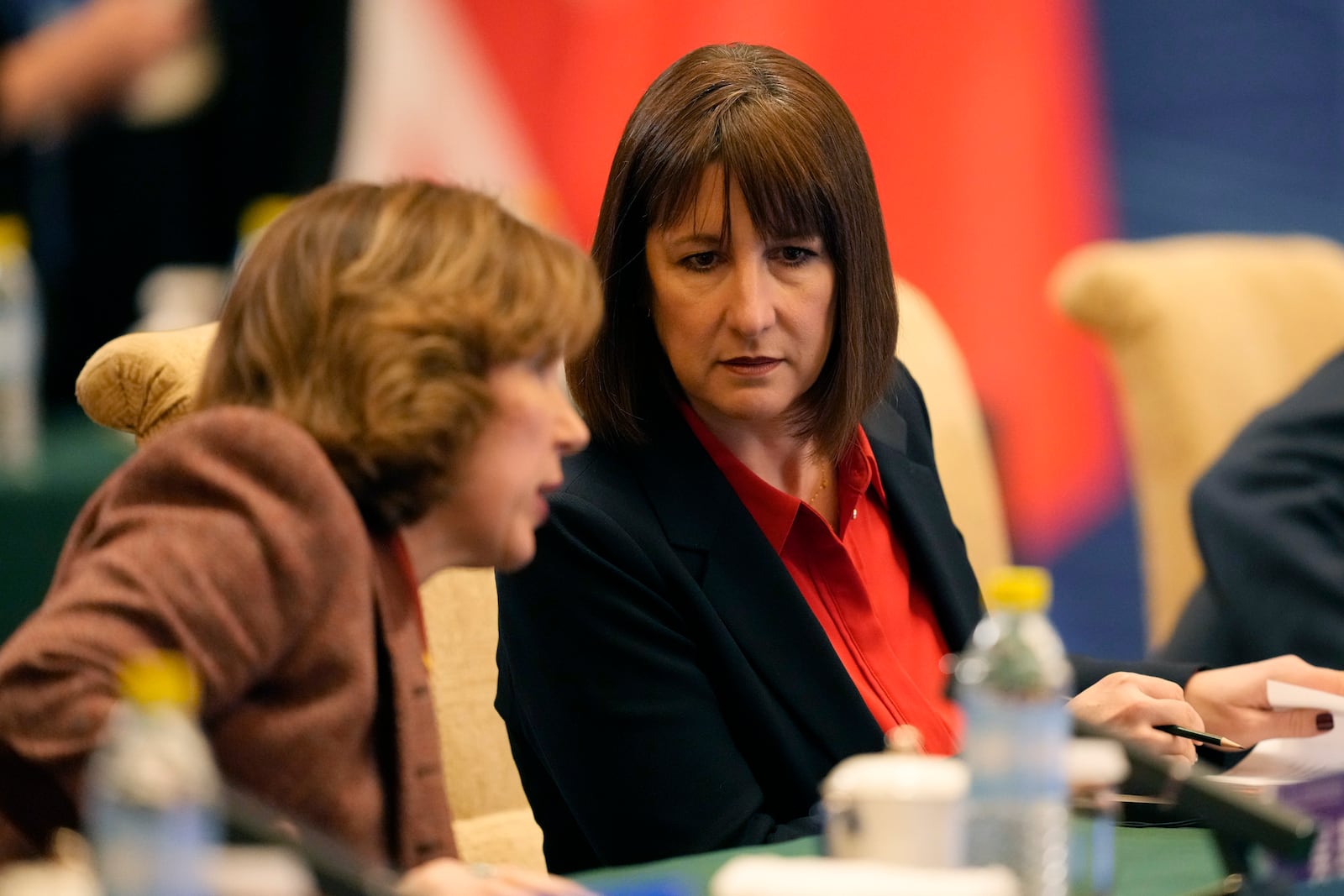 Britain's Chancellor of the Exchequer Rachel Reeves, right listens, during the 11th China - UK Economy and Finance Dialogue in Beijing, Saturday, Jan. 11, 2025. (AP Photo/Aaron Favila, Pool)