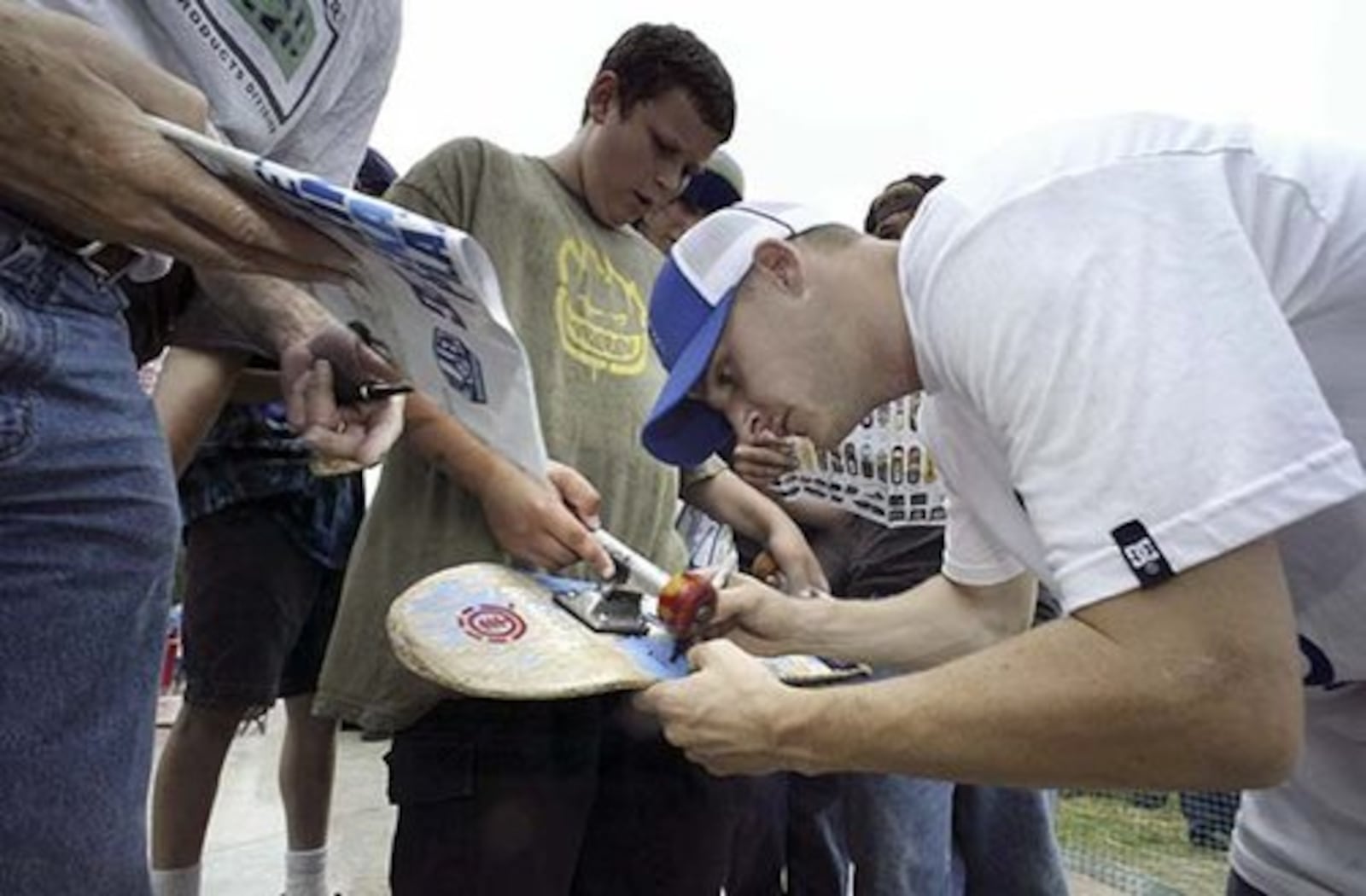 Kettering native and pro skateboarder Rob Dyrdek signs autographs after cutting the ribbon the new Kettering Skate Plaza he designed.