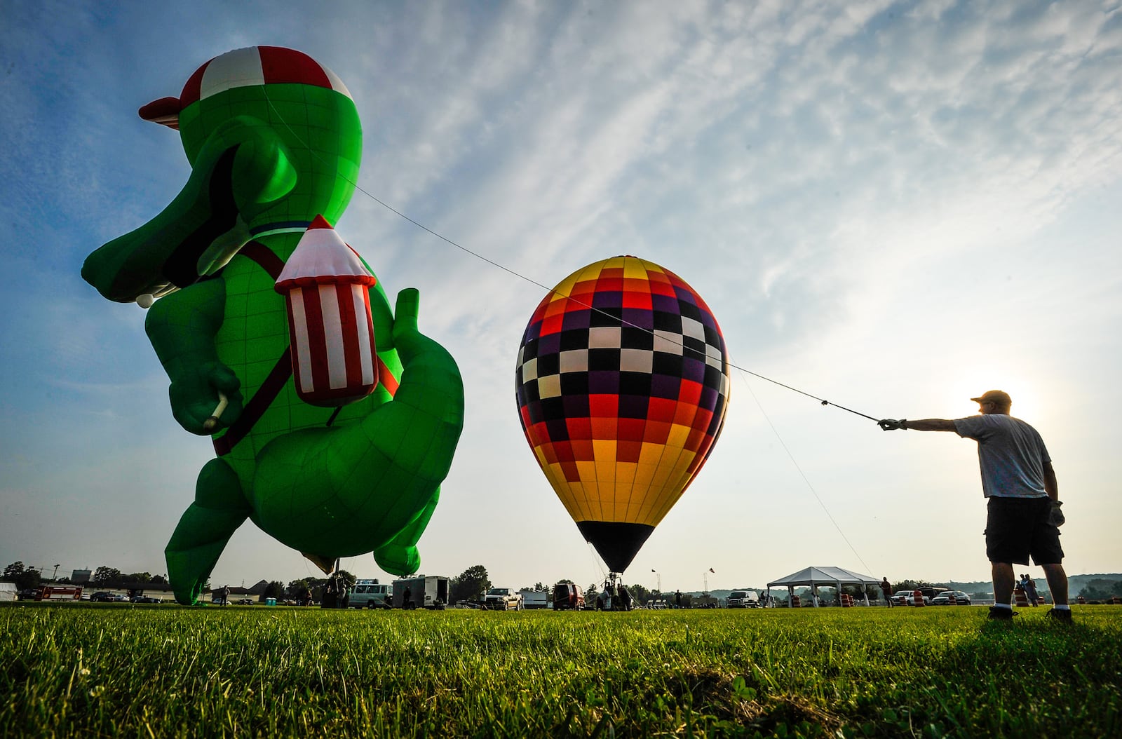 Sean Askren's hot air balloon "Bohica" and Doug Grimes' "The Gator" balloon were inflated during a media preview Thursday, July 20 for The Ohio Challenge Hot Air Balloon Festival at Smith Park in Middletown. The event runs Friday through Sunday. For more information visit www.ohiochallenge.com. NICK GRAHAM/STAFF