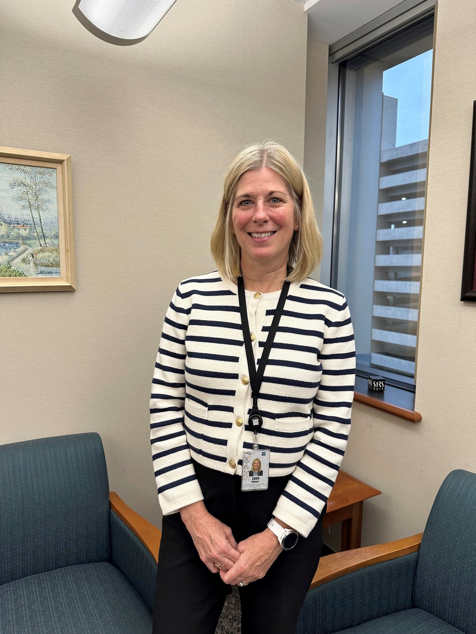 Acting Executive Director and Chief Financial Officer Lynn Hoover poses in her office at the headquarters of the State Teachers Retirement System in Columbus, Ohio, on Friday, Nov. 22, 2024. (AP Photo/Julie Carr Smyth)