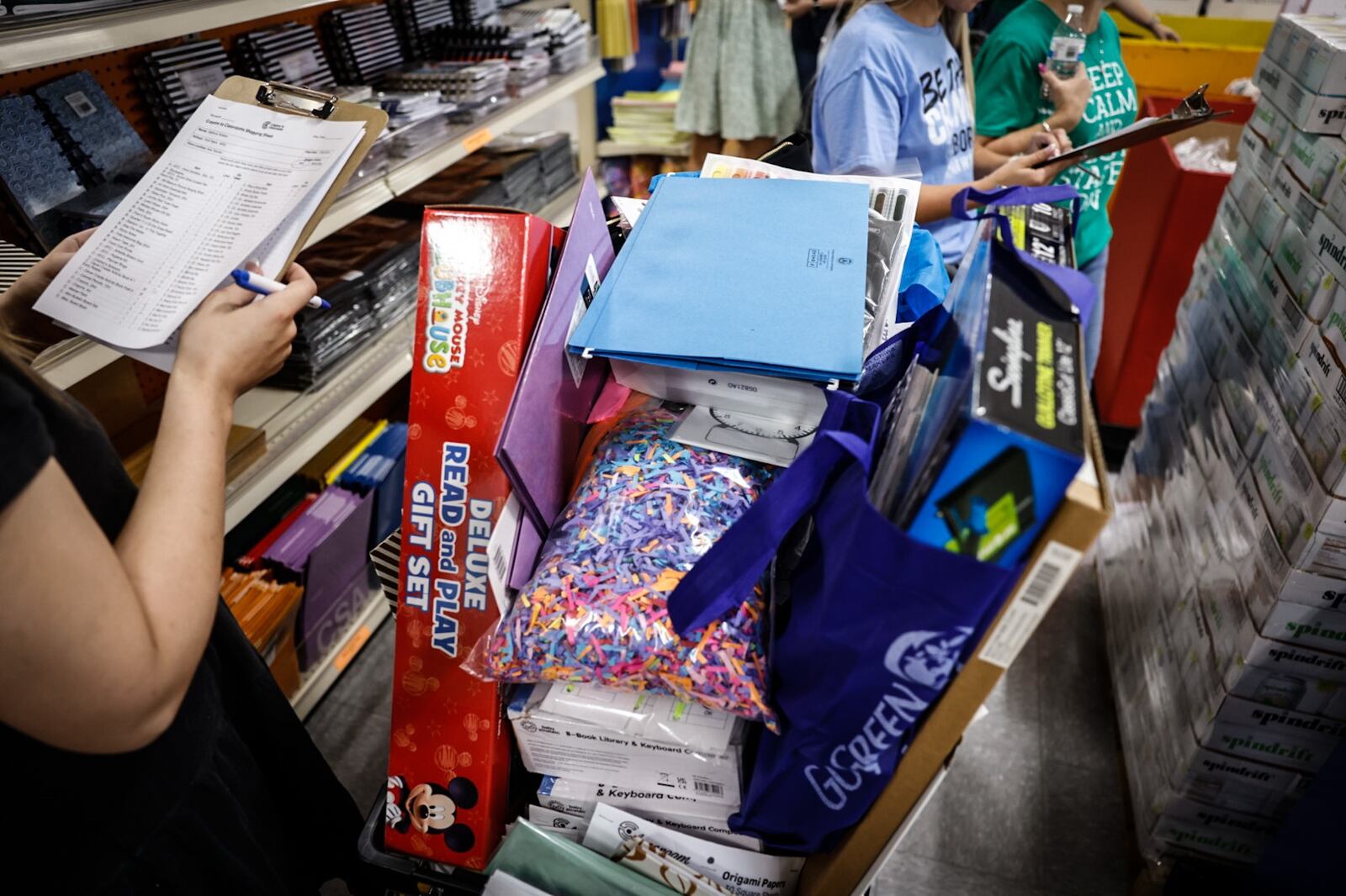 Crayons to Classrooms offers first year teachers from Wright State University a grocery cart full of supplies. JIM NOELKER/STAFF