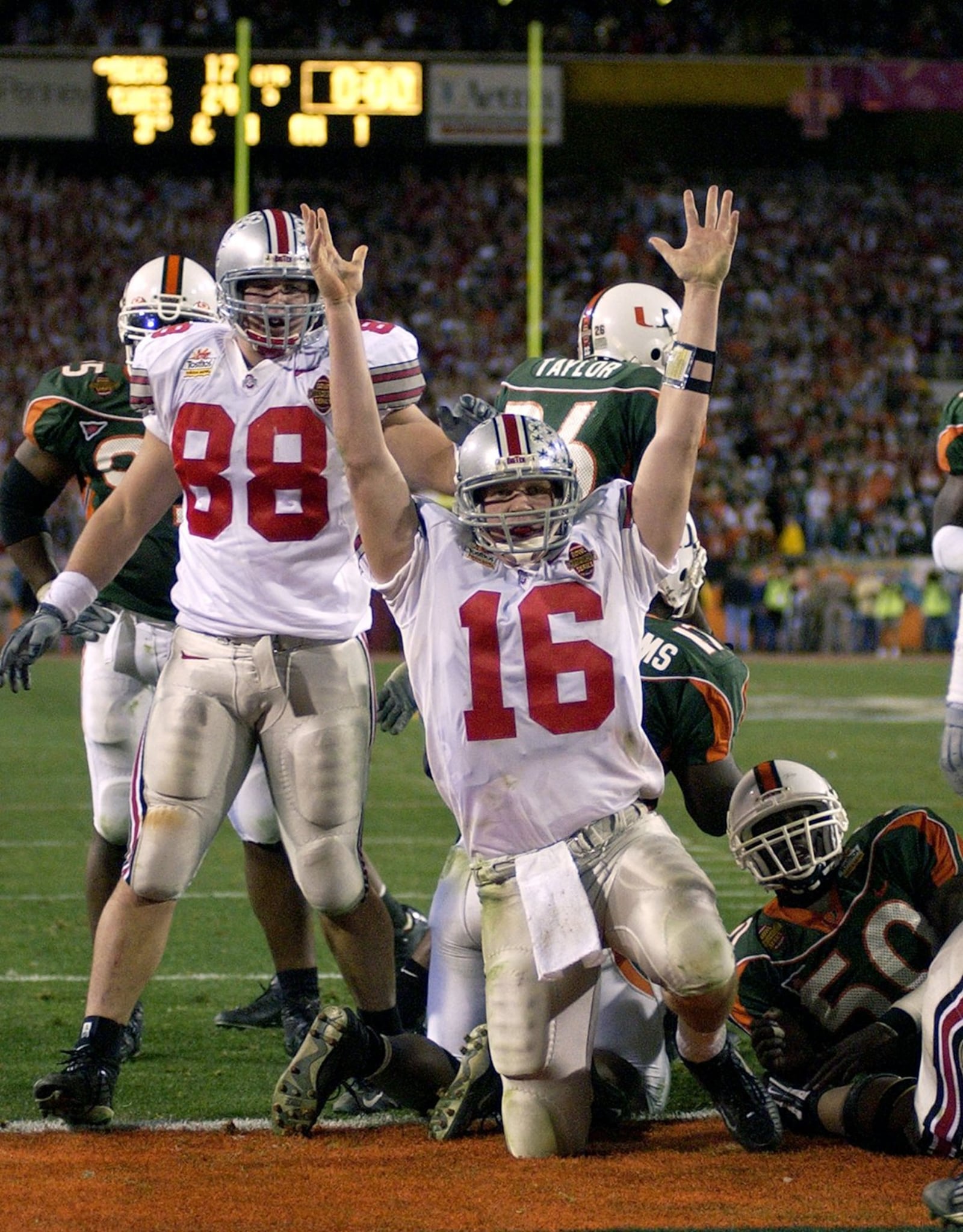 2003: Ohio State’s Craig Krenzel celebrates his touchdown against Miami to tie the game and send it into a second overtime in the Fiesta Bowl on Jan. 3, 2003. The Buckeyes won 31-24. AP Photo/Mark J. Terrill