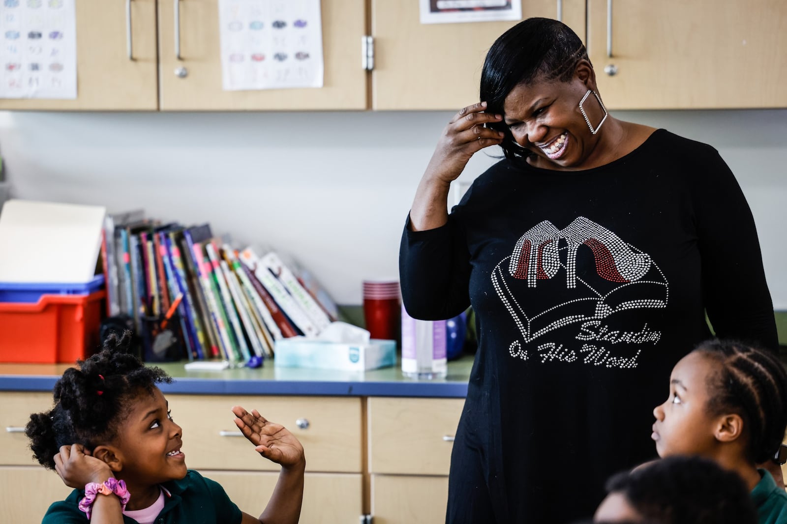 Angela Worley talks with students during the after school program at Westwood Elementary School on Oakridge Dr. JIM NOELKER/STAFF