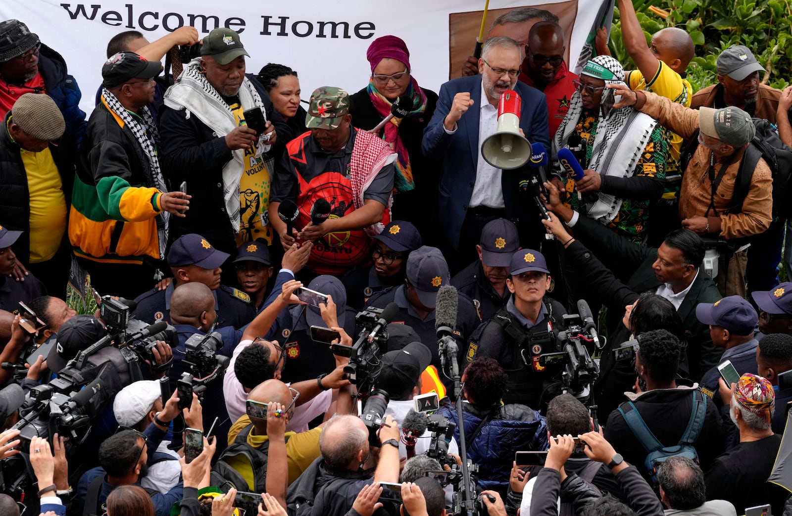 Expelled South Africa Ambassador Ebrahim Rasool speaks to supporters upon his arrival at Cape Town International Airport, in Cape Town, South Africa, Sunday, March 23, 2025. (AP Photo/Nardus Engelbrecht)