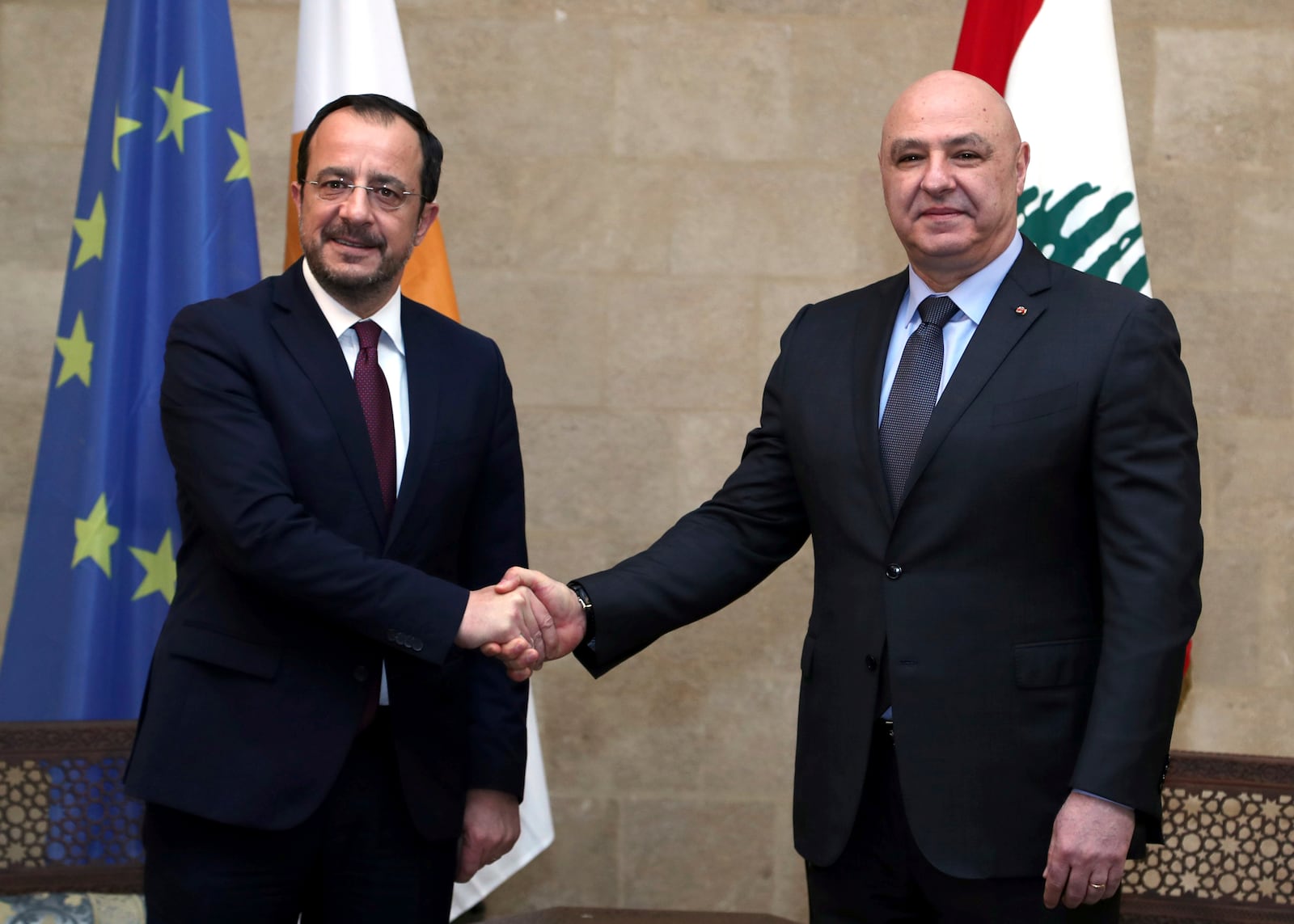 In this photo released by the Lebanese Presidency press office, Lebanese president Josephl Aoun, right, shakes hands with his Cypriot counterpart Nikos Christodoulides, at the presidential palace in Baabda, east of Beirut, Lebanon, Friday, Jan. 10, 2025. (Lebanese Presidency press office via AP)