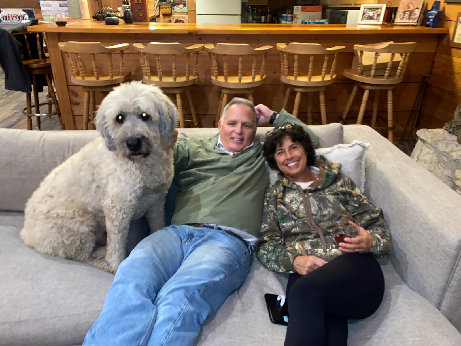 Raiff (right) with her husband Mike and dog Ben at home