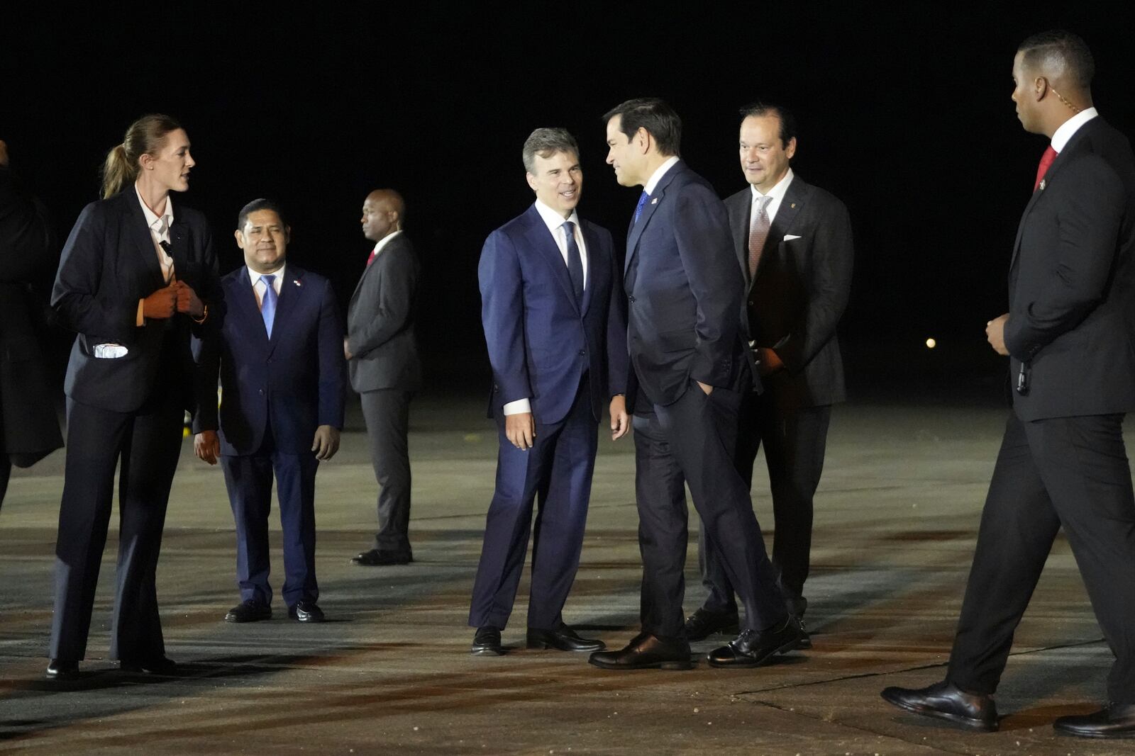 Secretary of State Marco Rubio, third from right, is received by Panamanian Foreign Minister Javier Martínez-Acha, second left, and John Barrett, Chargé d'affaires, at the international airport in Panama Pacifico, Saturday, Feb. 1, 2025. (AP Photo/Mark Schiefelbein, Pool)