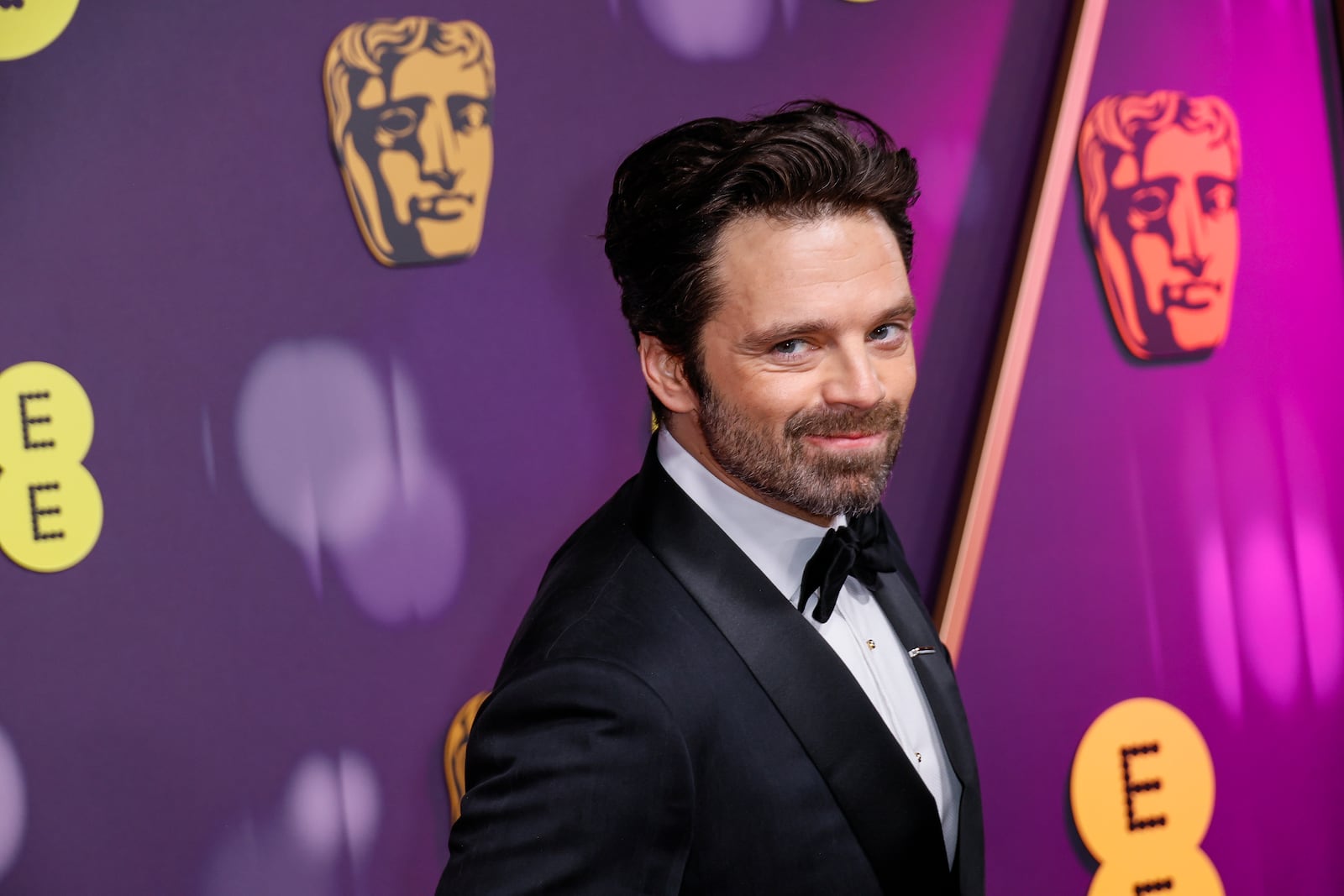 Sebastian Stan poses for photographers upon arrival at the 78th British Academy Film Awards, BAFTA's, in London, Sunday, Feb. 16, 2025. (Photo by Joel C Ryan/Invision/AP)