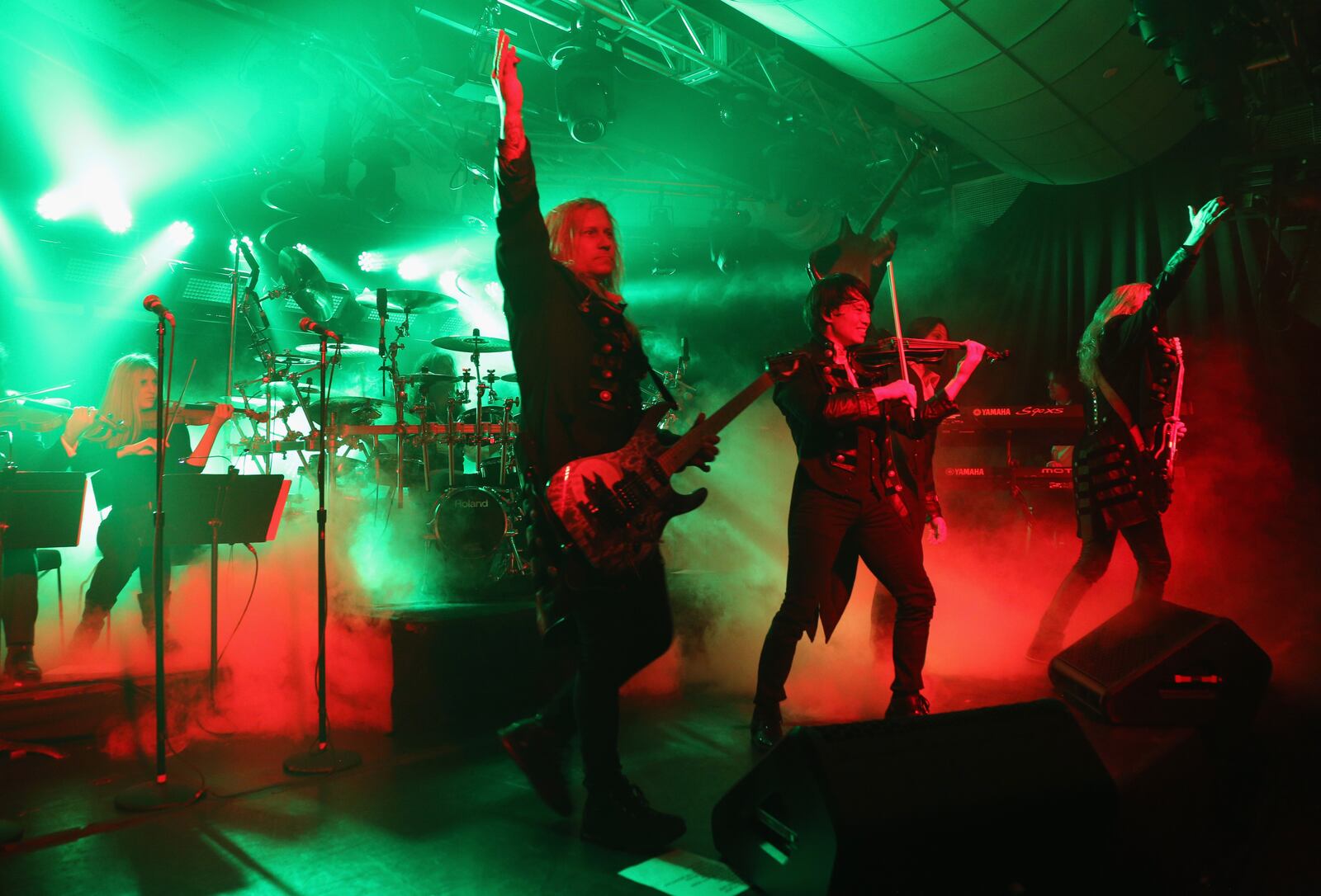 NEW YORK, NY - NOVEMBER 17:  (L-R) Chris Caffery, Roddy Chong, David Z and Joel Hoekstra of Trans-Siberian Orchestra perform onstage during an exclusive performance at The iHeartRadio Theater in New York at iHeartRadio Theater on November 17, 2014 in New York City.  (Photo by Anna Webber/Getty Images for iHeart Radio)