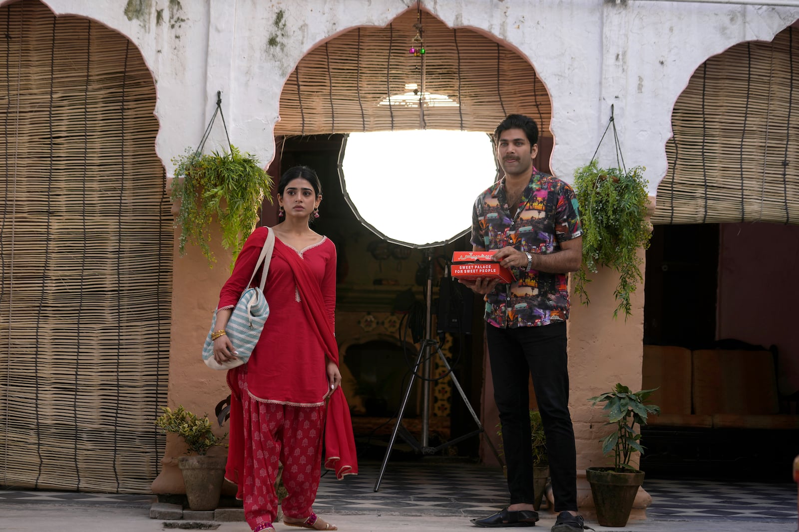 Pakistani tv actor Usman Javed, right, and Sehar Khan perform during the shooting of a scene of tv drama serial 'Tan Man Neel-o-Neel' or Deeply Engrossed in Love', in Rawalpindi, Pakistan, Saturday, Nov. 2, 2024. (AP Photo/Anjum Naveed)