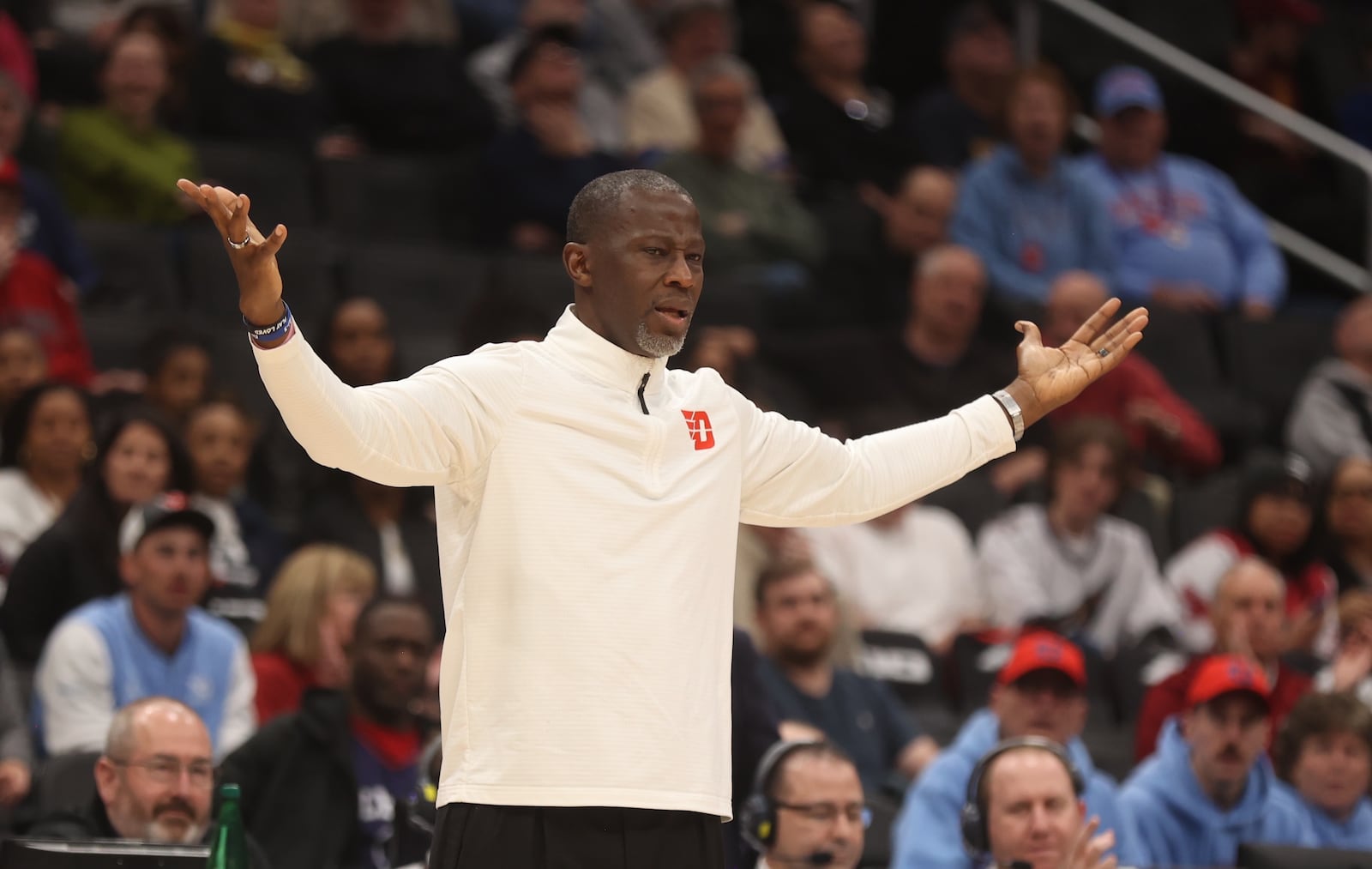 Dayton's Anthony Grant questions a call against Saint Joseph’s on Friday, March 14, 2025, in the quarterfinals of the Atlantic 10 Conference tournament at Capital One Arena in Washington, D.C. David Jablonski/Staff