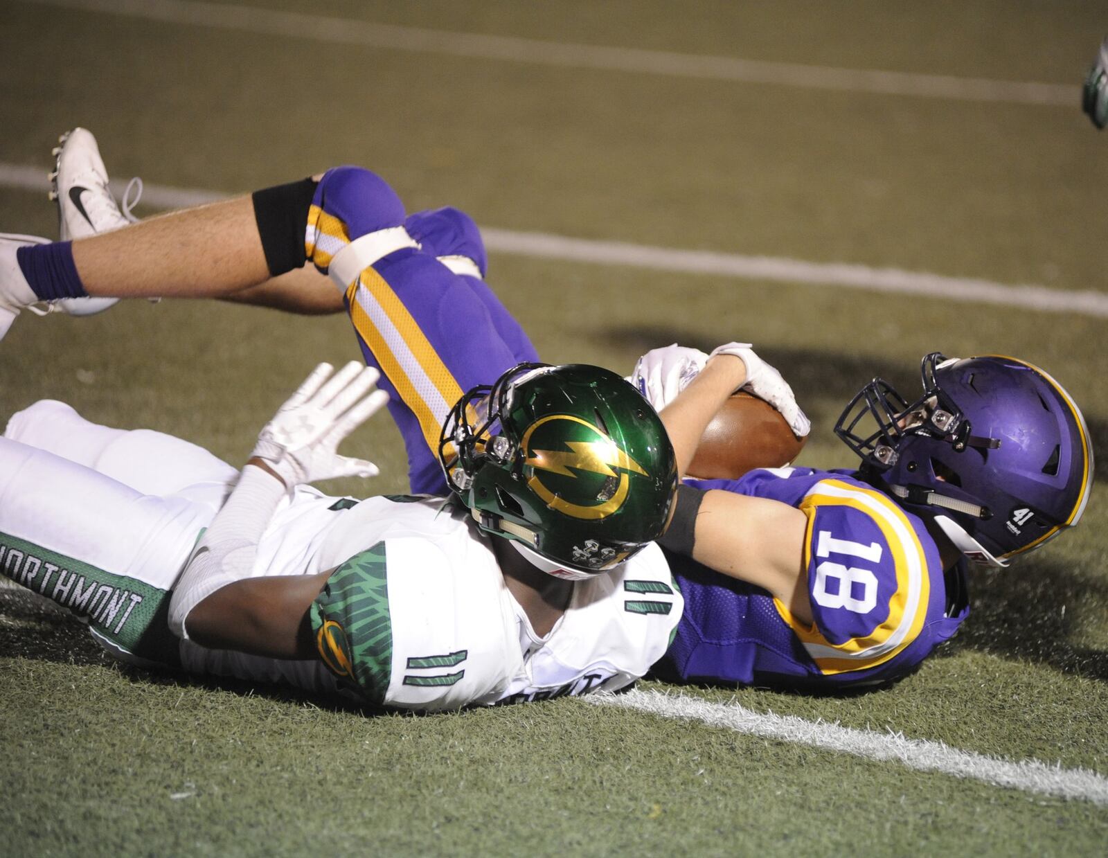 Butler senior Blake Ross (right) secures a catch from Northmont’s Christian Cvetnic. Northmont defeated host Butler 43-16 in a Week 4 high school football game on Thursday, Sept. 13, 2018. MARC PENDLETON / STAFF